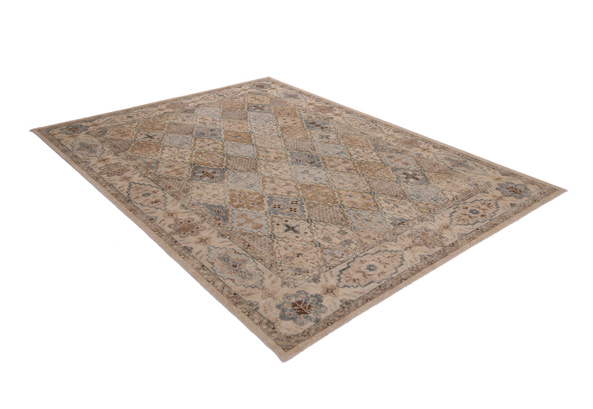 This contemporary Tabriz hand knotted wool rug hails from Rug & Kilim’s Homage collection, enjoying a finer take on distressed shabby chic aesthetic with fewer knots per square inch. The soft gold, blue, and white colorways complement a versatile