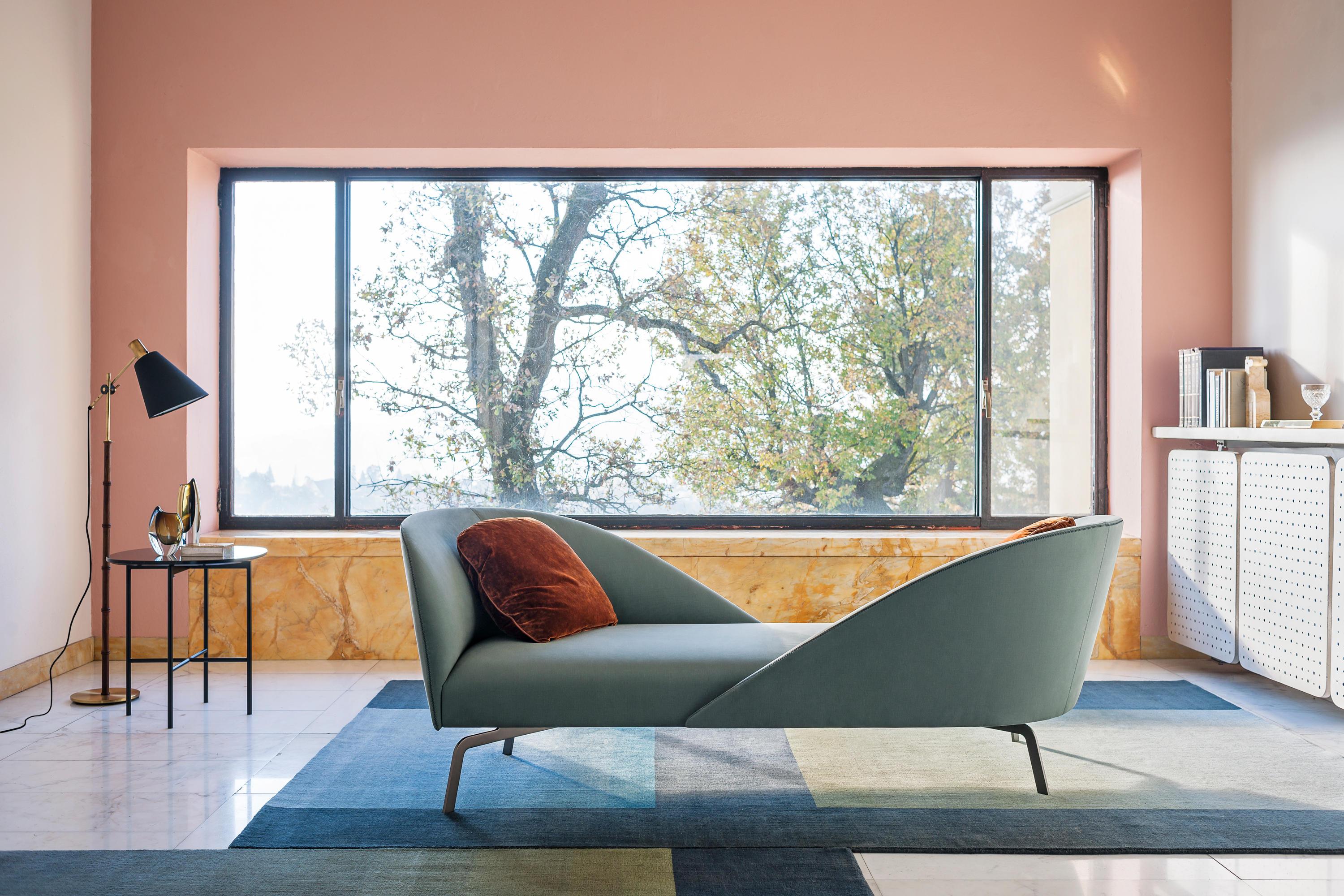 Face to Face is an original reinterpretation of the sofa as a space for one-to-one relations, with two opposing backs and soft, feather cushions inviting people to sit vis-à-vis. With its light, classical style, Face to Face is conceived to take a