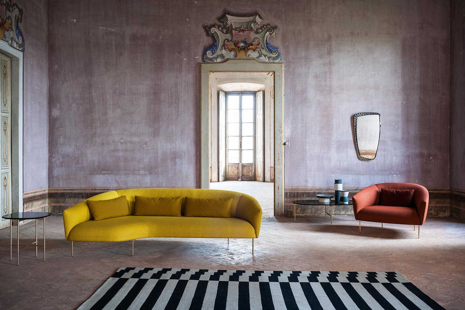 Almost suspended above the floor, with the slenderest of legs upholding a large, cosy seat. Jonas Wagell imagines a family of sofas, inspired by the soft, curving form of a semicircle: this little collection, from armchair to sofa to chaise longue,