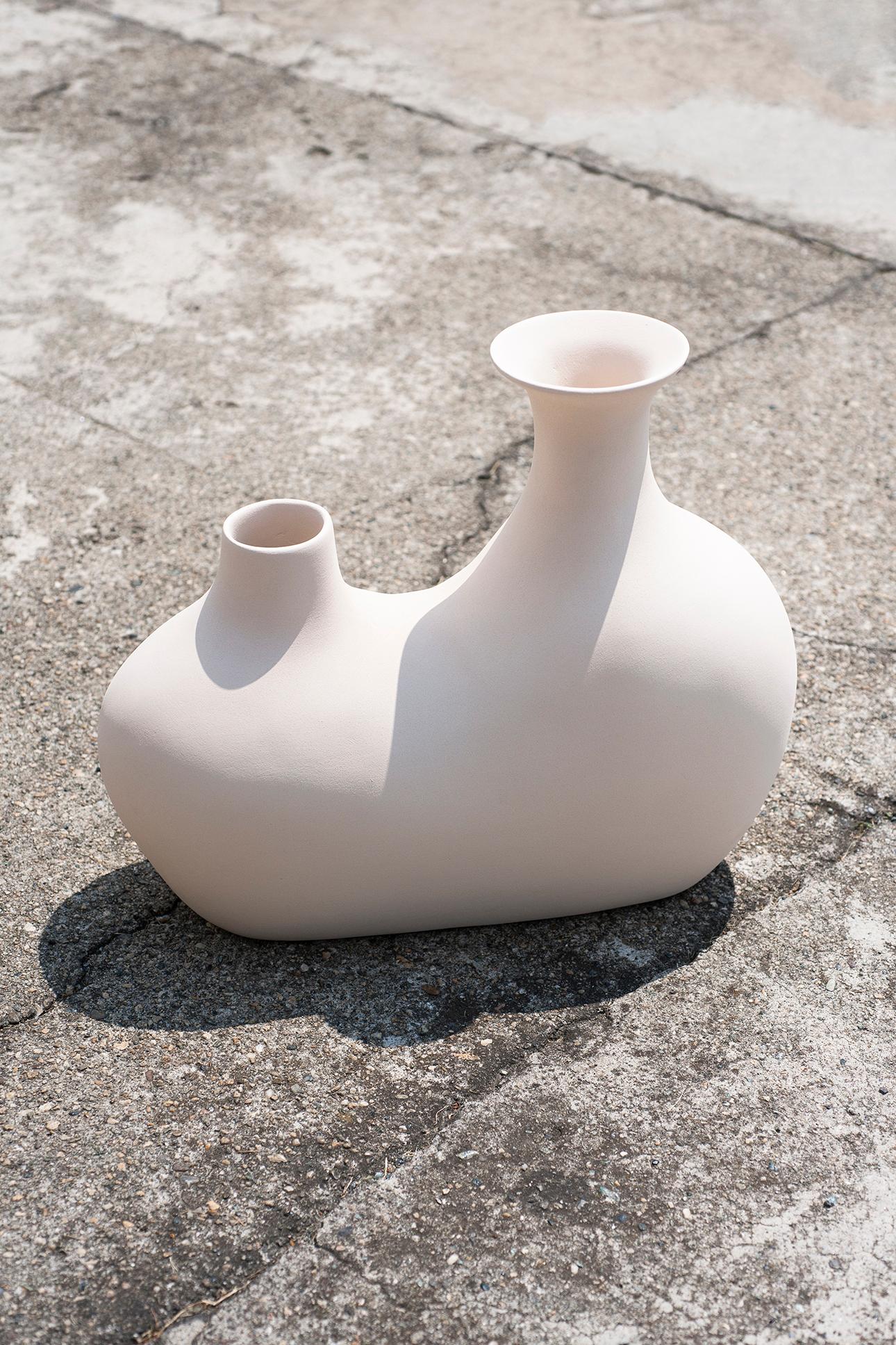 Tacchini Venus ceramic vase in white by Studiopepe. Named Venus in honor of the planet long associated with beauty and harmonious shapes, the vase’s rounded contours celebrate femininity and the anatomical sinuousness of classical