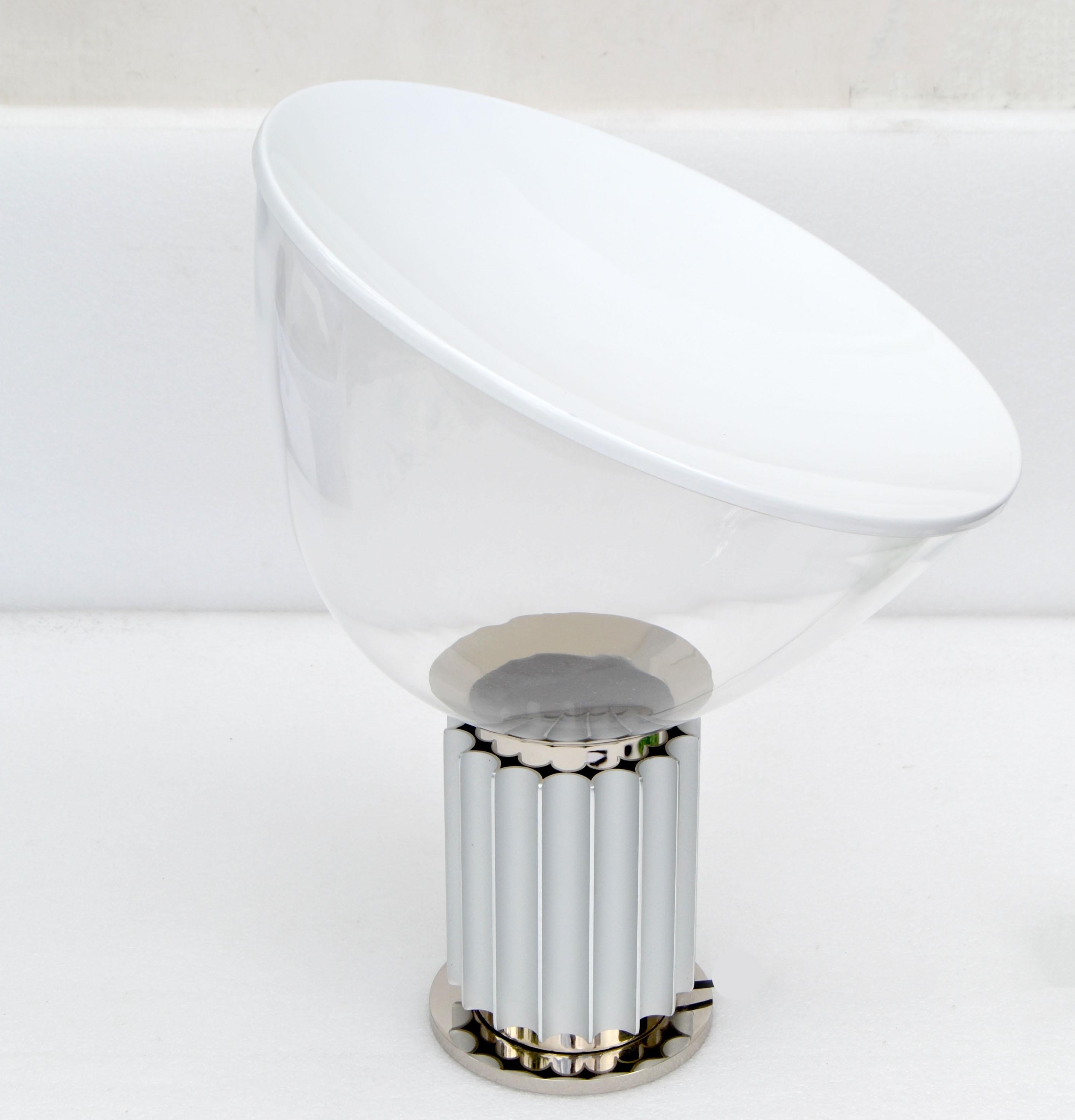Taccia lamp by Castiglioni Brothers
Base is stainless steel, round glass diffuser shade and white opaline glass top.
In perfect working condition and takes a regular light bulb, LED work too.
Comes with in between cord light switch.
Very heavy