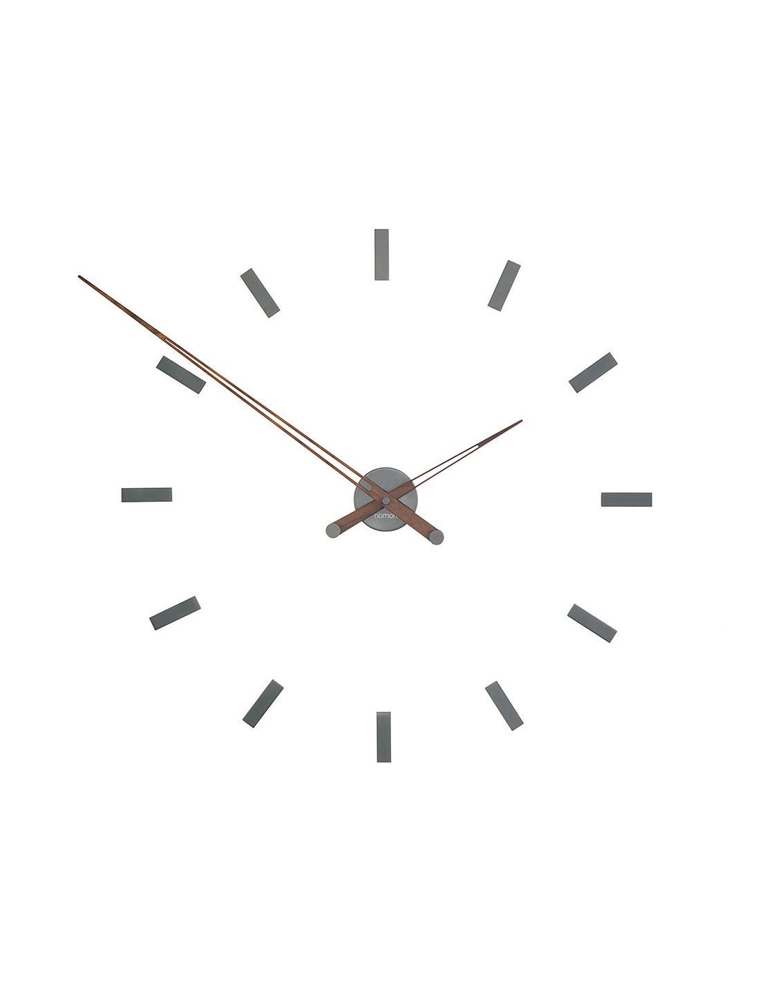 Tacón 12 T wall clock is a clock with a lot of visual strength, a steel clock with 12 time signals. These lines have made the Heel clock one of the most charismatic clocks
Tacón 12 T wall clock : Graphite finished brass, hands in walnut.
Each