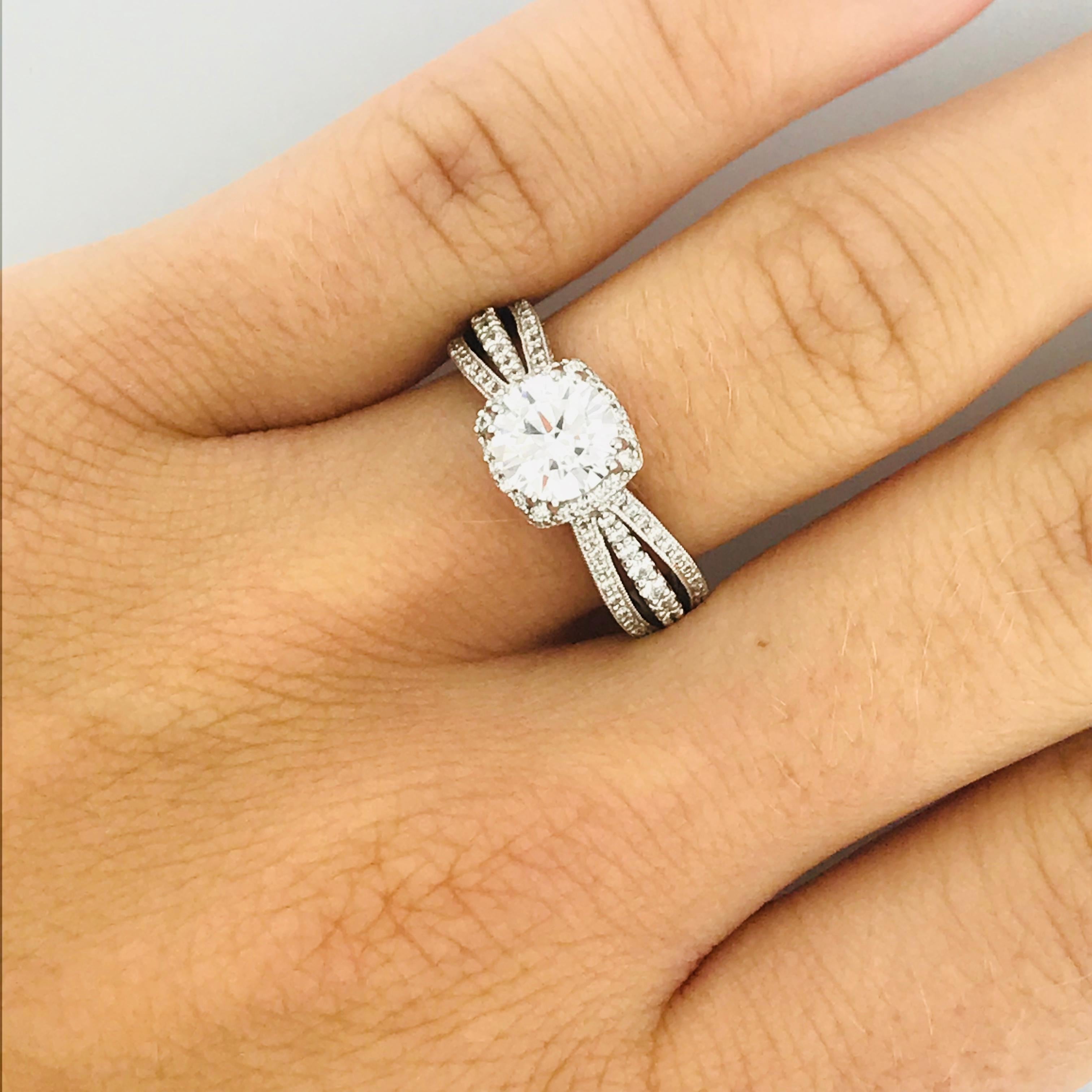This is an original TACORI ENGAGEMENT RING! The ring has the Tacori authorized style number, 101373. The 18 karat white gold Tacori engagement ring holds a GIA CERTIFIED 1.02 carat ROUND BRILLIANT DIAMOND. The round brilliant diamond is an eye clean