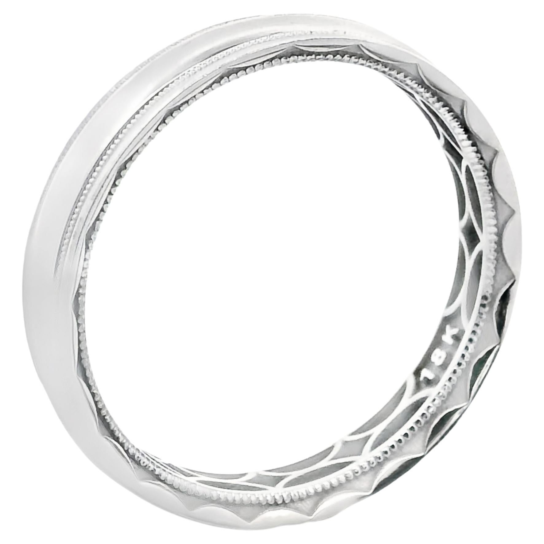 Tacori 106-5W men's wedding band in 18K white gold and 5 millimeters in width.  This ring has a high polish finish and is bordered by beaded rows near the outer edges. Only for your own amusement and joy, hidden along the inside of the ring is
