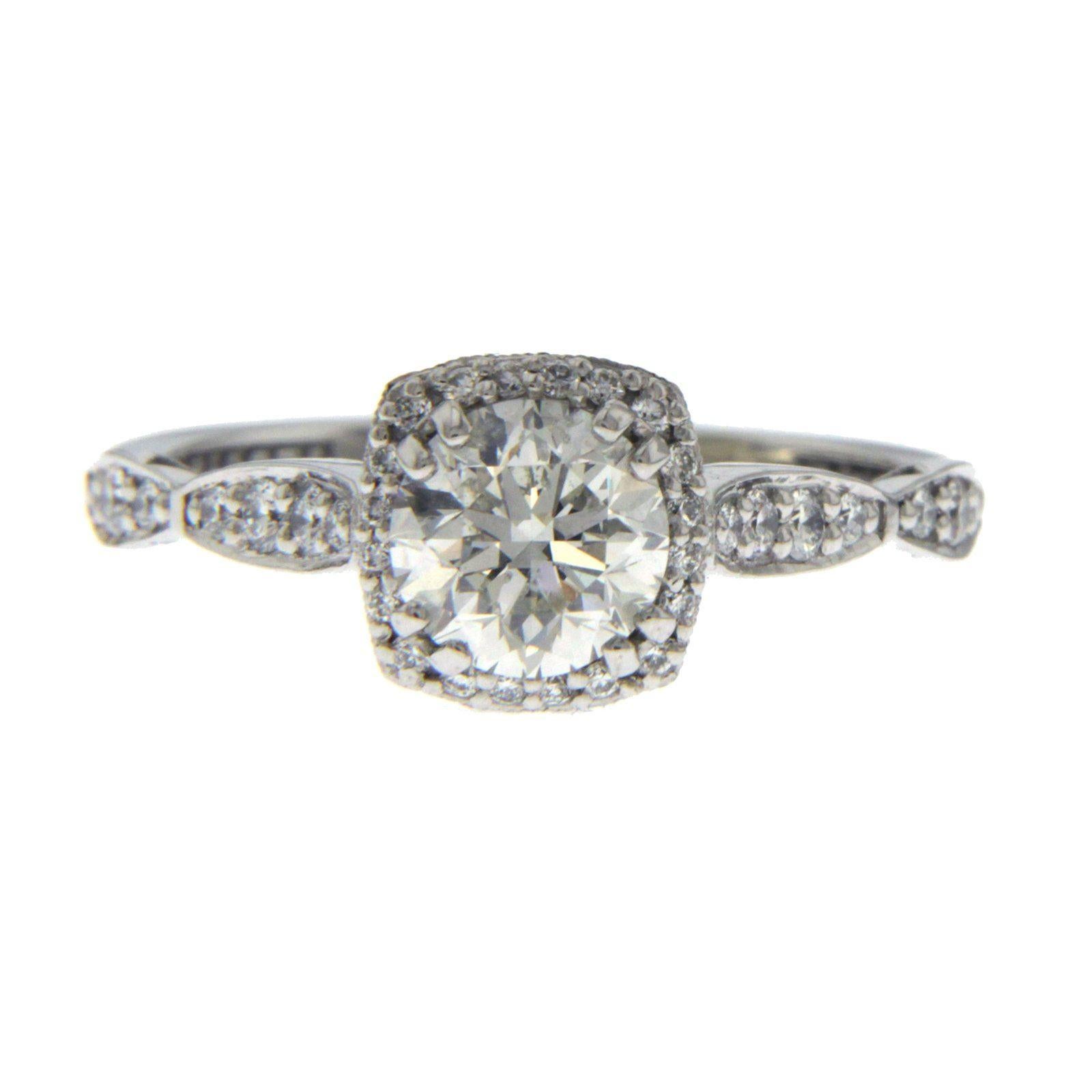 This is a Tacori 18K White Gold with 1.01 CT Center Diamond sold by Robbins Brothers. Comes with Robbins Brothers Invoice and Tacori Certificate and box.

Top: 8 mm
Band Width: 2 mm
Metal: 18K White Gold 
Size: 6.5
Hallmarks: TACORI 750
Total