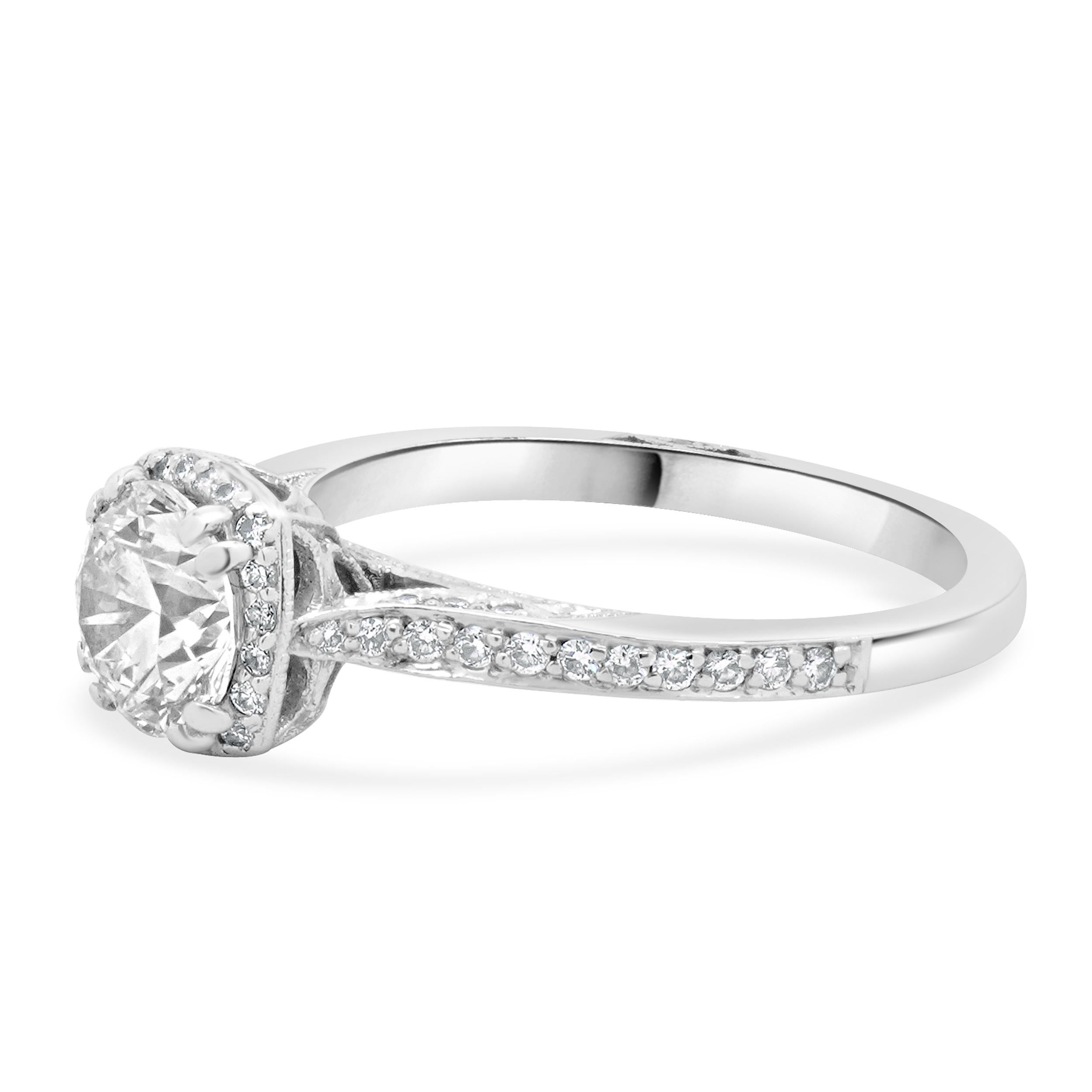 Designer: Tacori
Material: 18K white gold
Diamond: round brilliant cut = 1.05ct
Color: I
Clarity: SI2
Diamond: 43 round brilliant cut = 0.57cttw
Color: G
Clarity:VS2
Ring size: 6.5 (please allow two additional shipping days for sizing