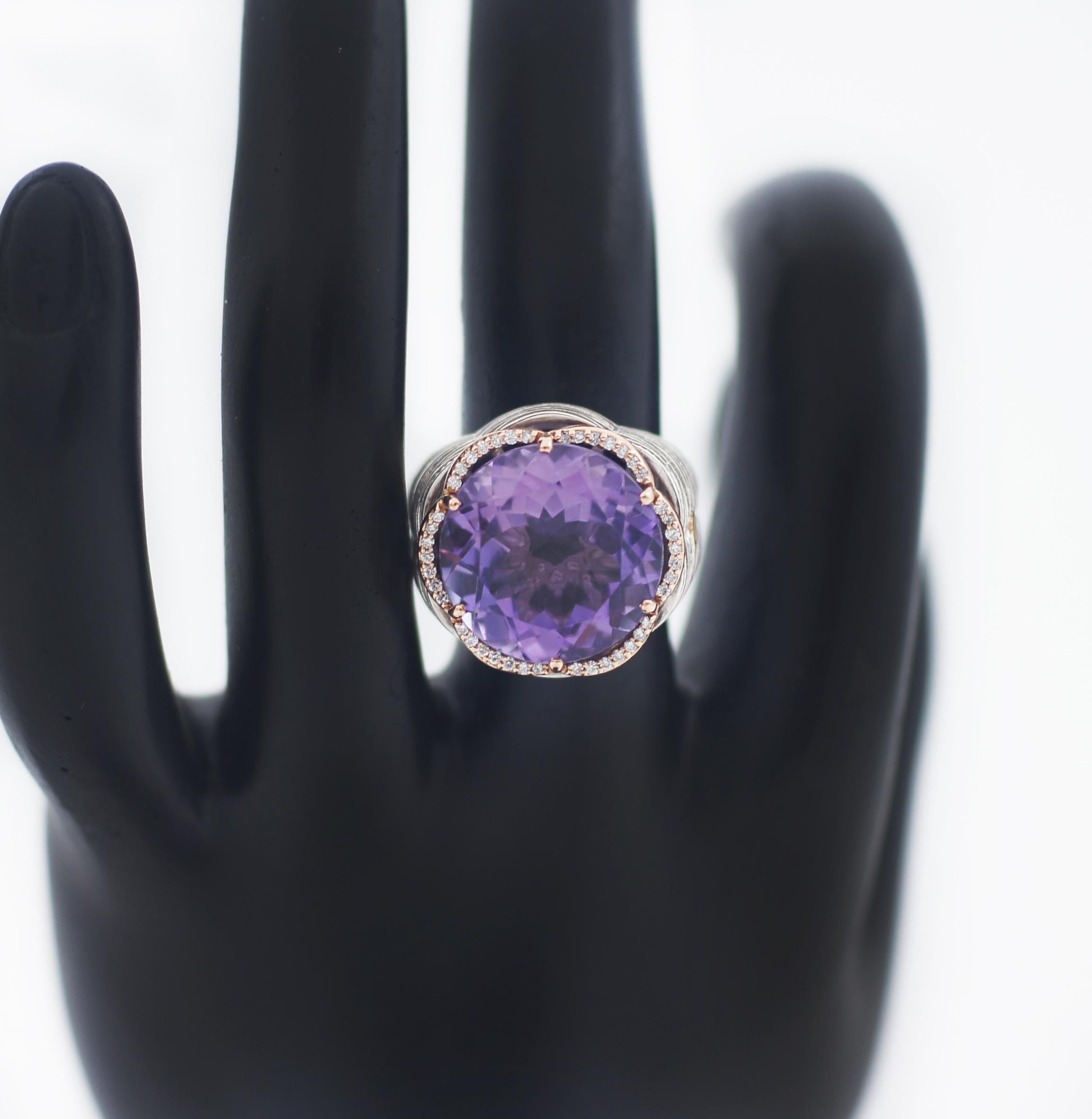 TACORI 18K 925 Silver Round Amethyst & Diamond Crescent Crown Ring
TACORI
Diamond Crescent Crown
Amethyst Large Gemstone
Sterling silver 925 and 18KT Rose gold
Approx. 10mm Diameter Round Amethyst 
Size 7
This beautiful pre-loved ring is in great