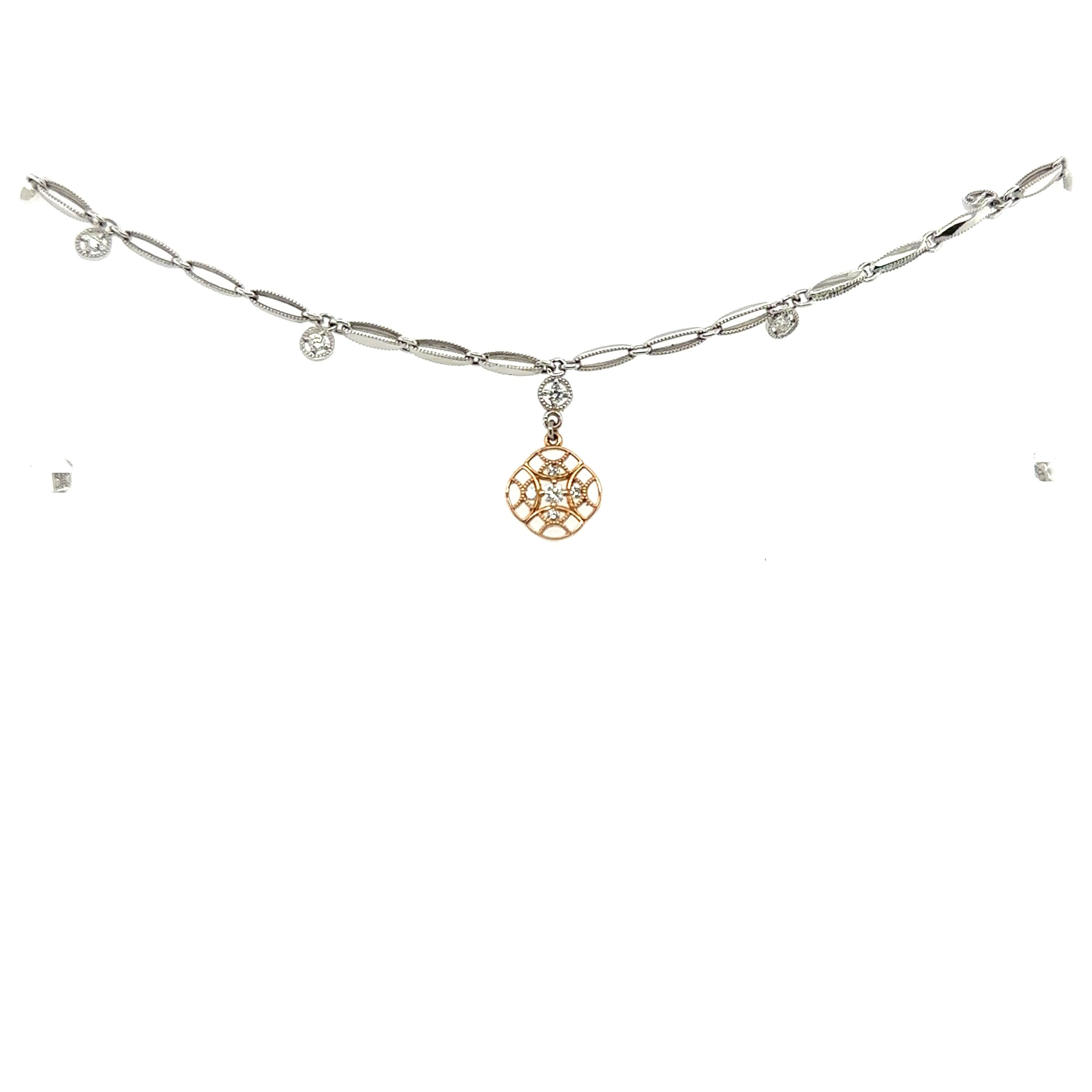 From American Jewellry company Tacori comes thos delicate bracelet. Crafted of 18k white gold with 6 small diamond charms hanging around the bracelet. A beautiful rose gold charm hangs from the center of the bracelet and is set with 5 sparkling