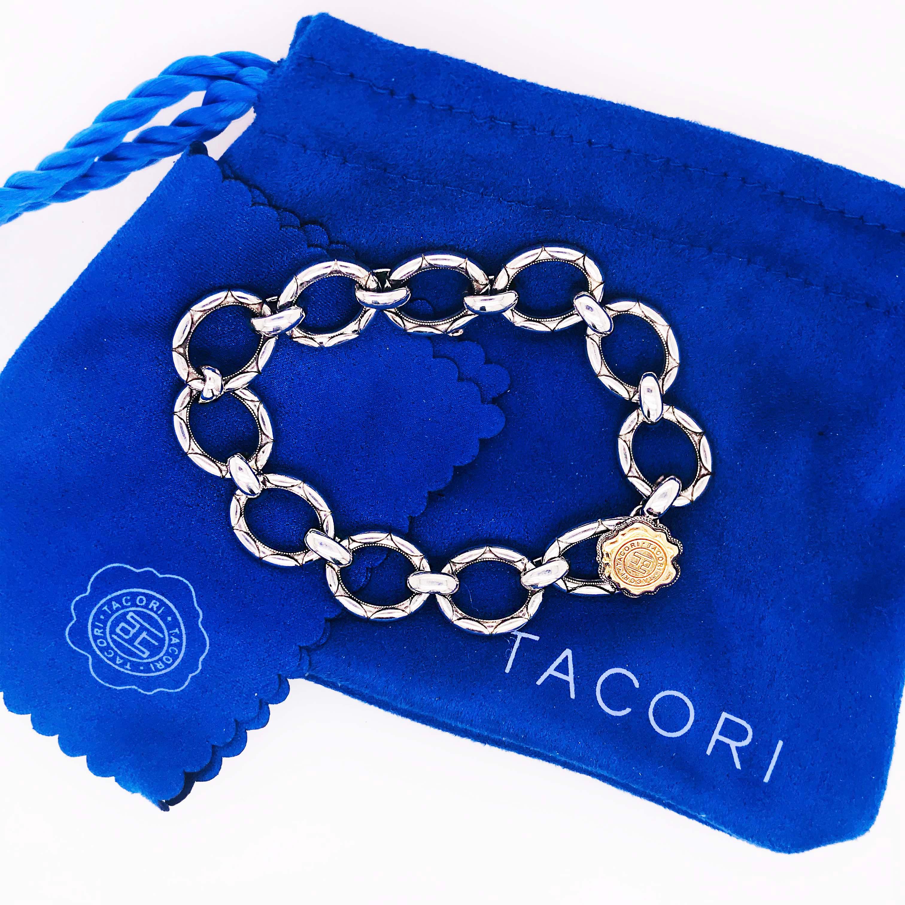 This is an original Tacori 18k925 link bracelet in sterling silver and 18 karat yellow gold. Each link has been hand made with the signature Tacori crescent design. The clasp is an 18 karat yellow gold Tacori seal. The 18 karat yellow gold seal