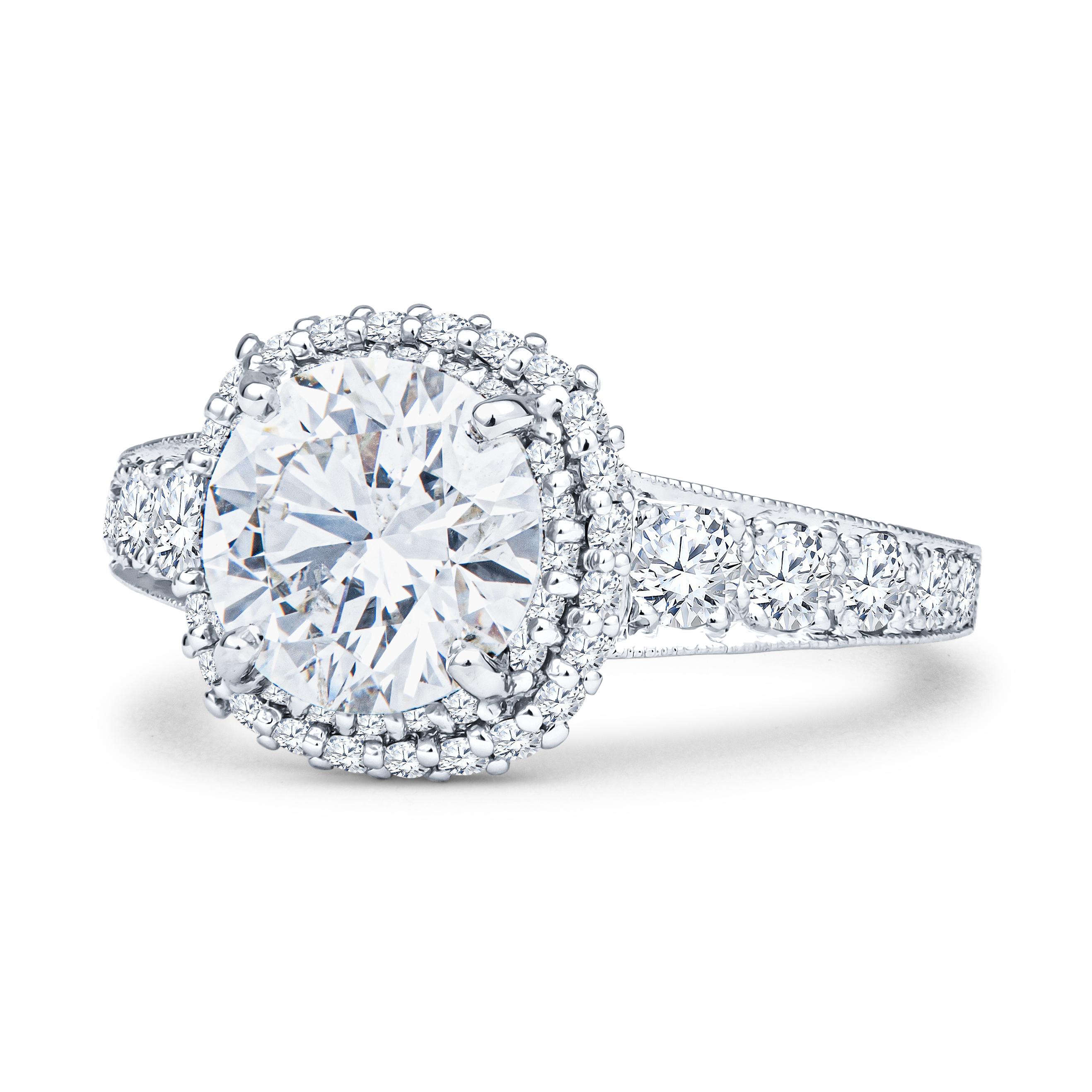 This exquisite, expertly crafted Tacori ring features a 2.01ct round brilliant, K SI2 (HRD 190000126863, inscribed) diamond, set in a platinum Tacori ring, with approximately 0.99ct total weight in round brilliant diamonds tapering down the sides of