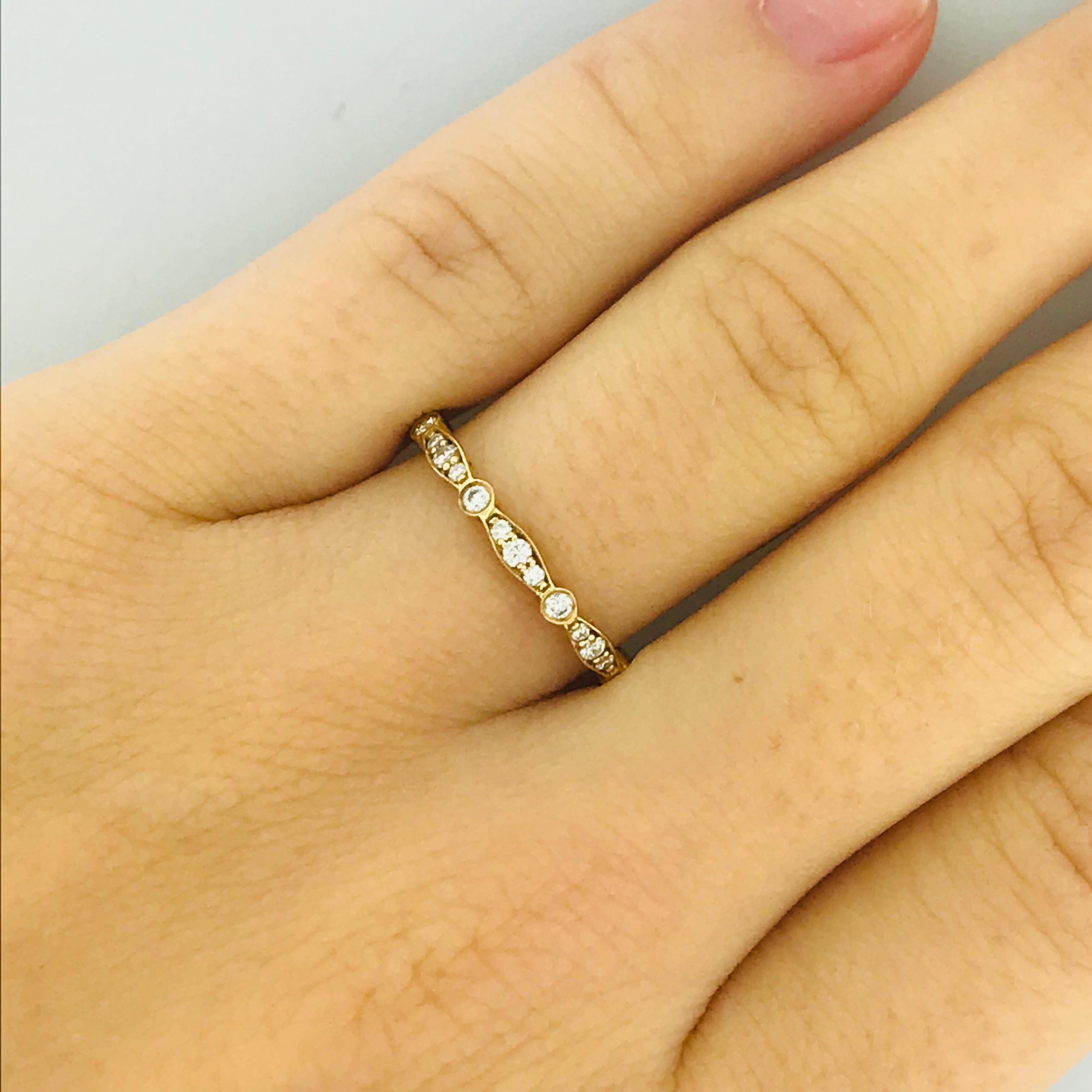 This original Tacori ring is an original Tacori diamond eternity band made with rich 18 karat yellow gold and bright white diamonds. The ring is new, never before worn and comes with the original Tacori box. This would make the most fun stackable