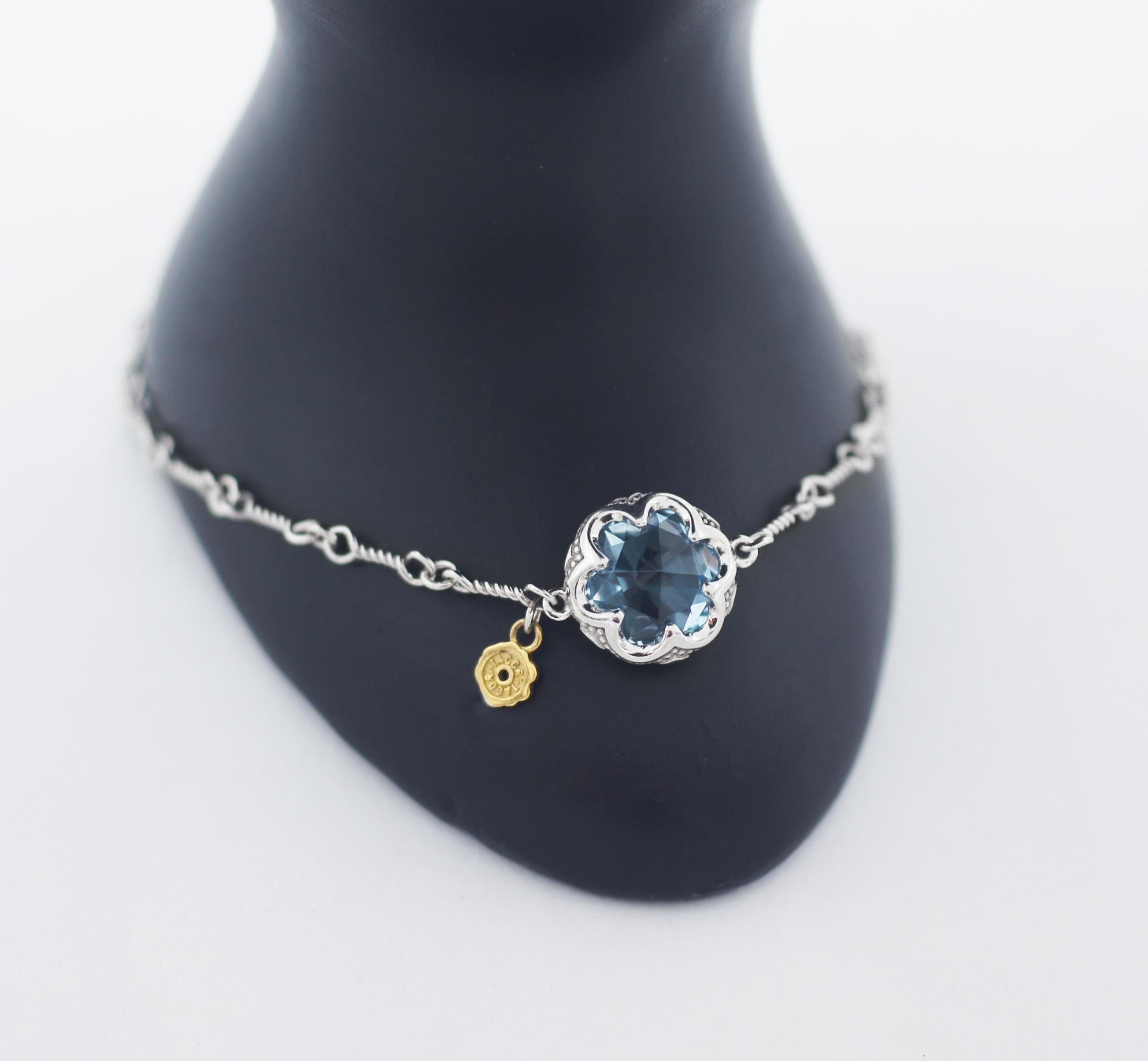 TACORI
925 Silver / 18K
Sonoma Skies
Crescent Gemstone Bracelet featuring Sky Blue Topaz
Tacori STYLE SB19802
Sonoma Skies Collection, this bracelet is surely something to behold. 
A beautiful Sky Blue Topaz gemstone sits delicately within a floral
