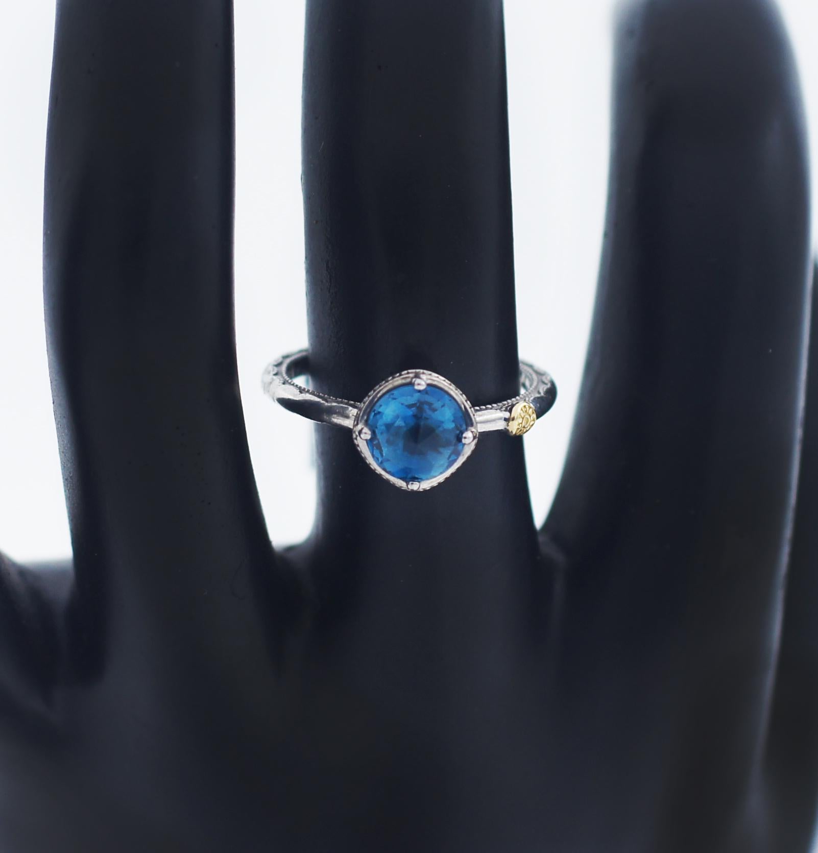 TACORI 
Gemma Bloom
Petite Simply Gem Ring featuring London Blue Topaz
Tacori STYLE SR13333
deep blue solitaire is perfect for you. The crescent engraved band with a combination of milgrain details and high polished finish exudes