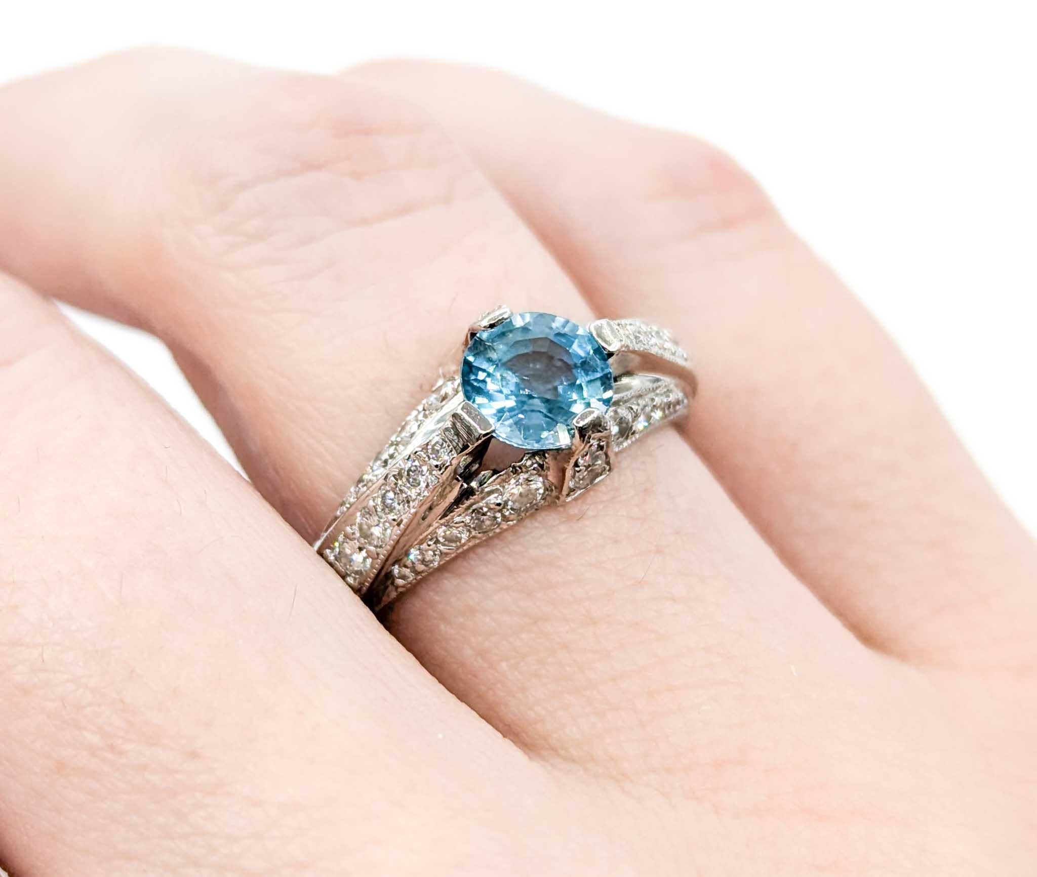 Beautiful Tacori Blue Zircon & Diamond Ring in Platinum

This Blue Zircon ring is crafted in platinum and features a 1.40ct zircon centerstone, the birthstone for December. The beautiful blue zircon is further enhanced by .65ctw in glittering