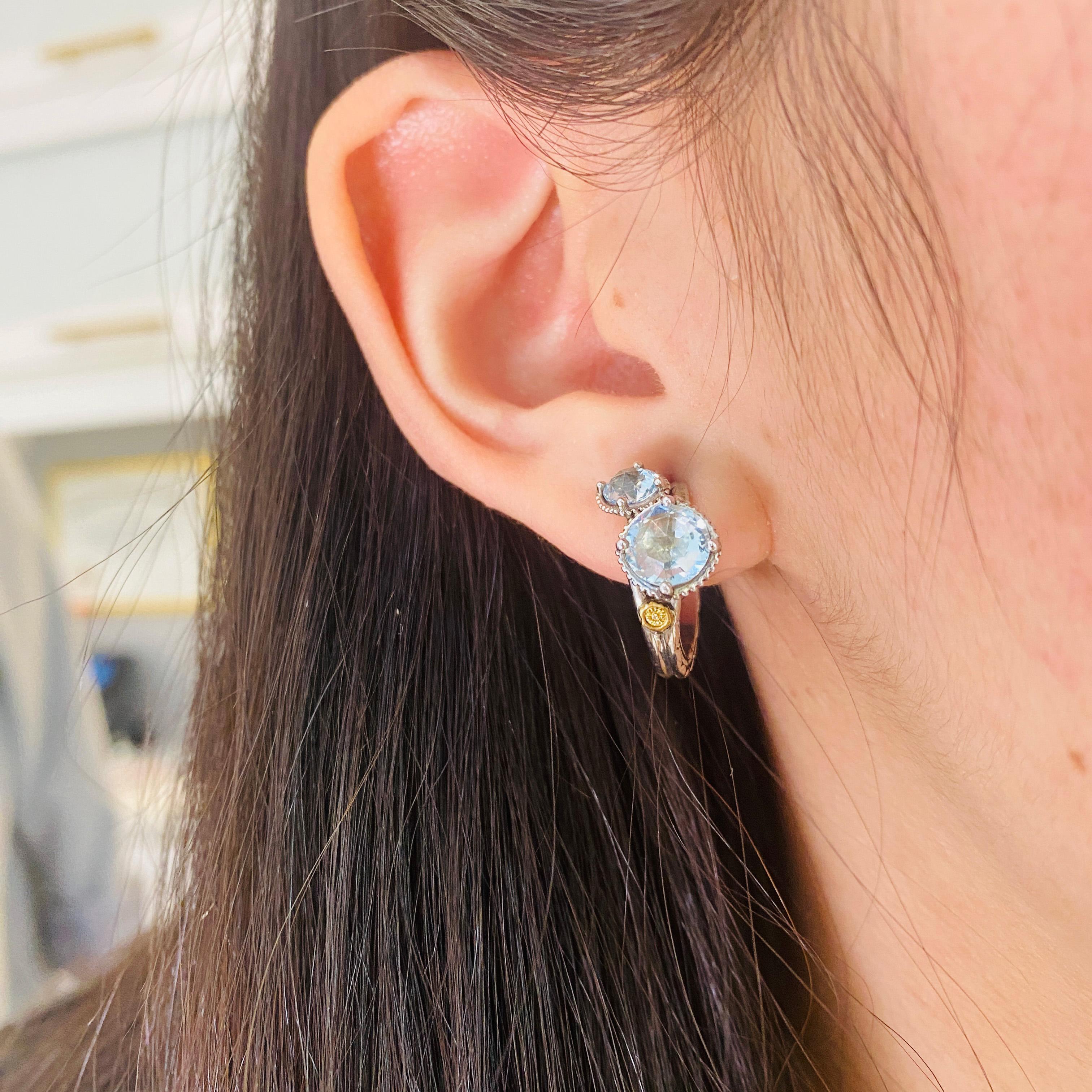 Tacori upholds their styling standards with these bright double sky blue topaz hoop earrings! These are great for any dressed up or down occasion! The double hoops flare to support the pair of topaz frames then gracefully tapers back into a sleek