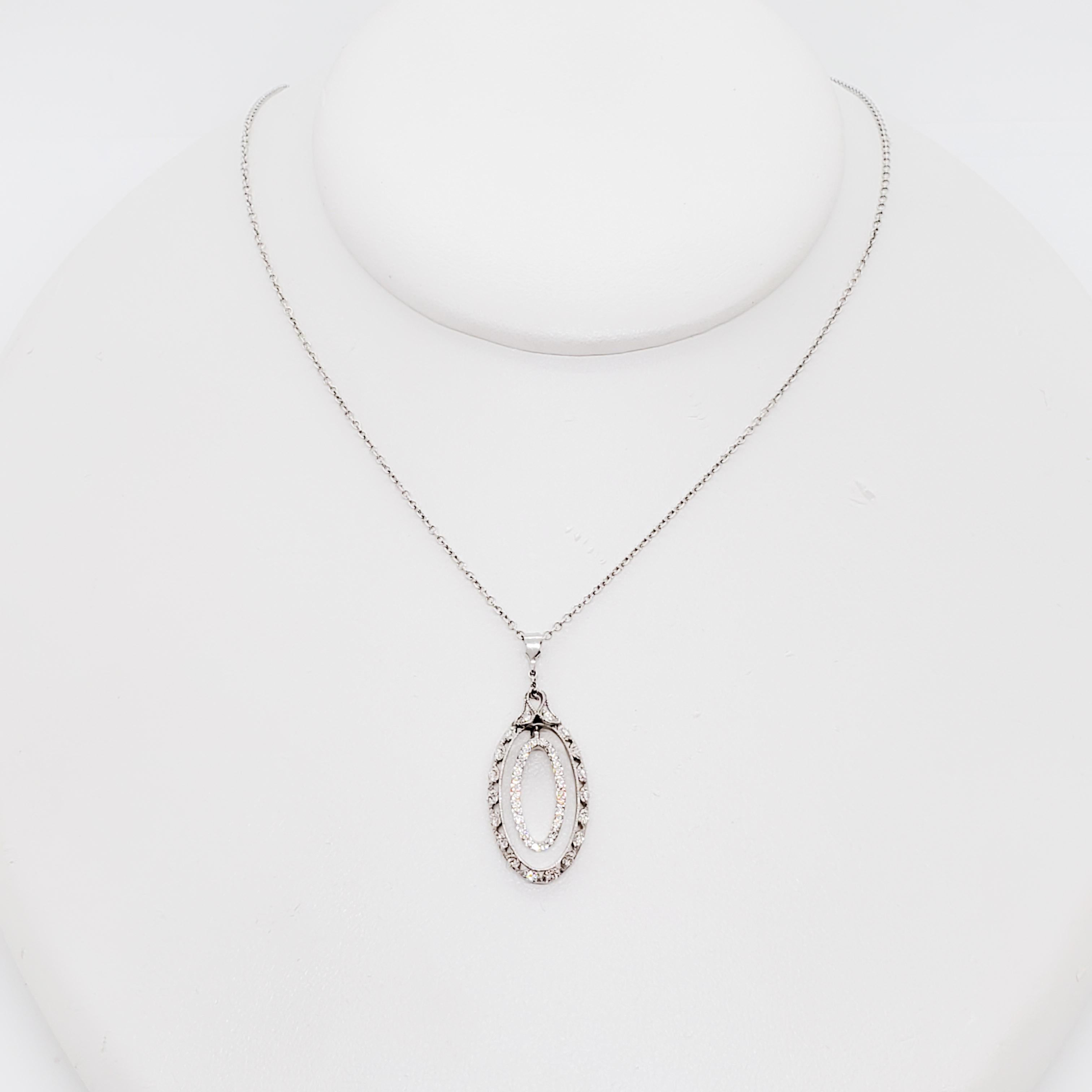Beautiful estate Tacori oval pendant necklace featuring 0.25 ct. of good quality white diamond rounds in a handmade 18k white gold mounting and chain.  Length of necklace is 18