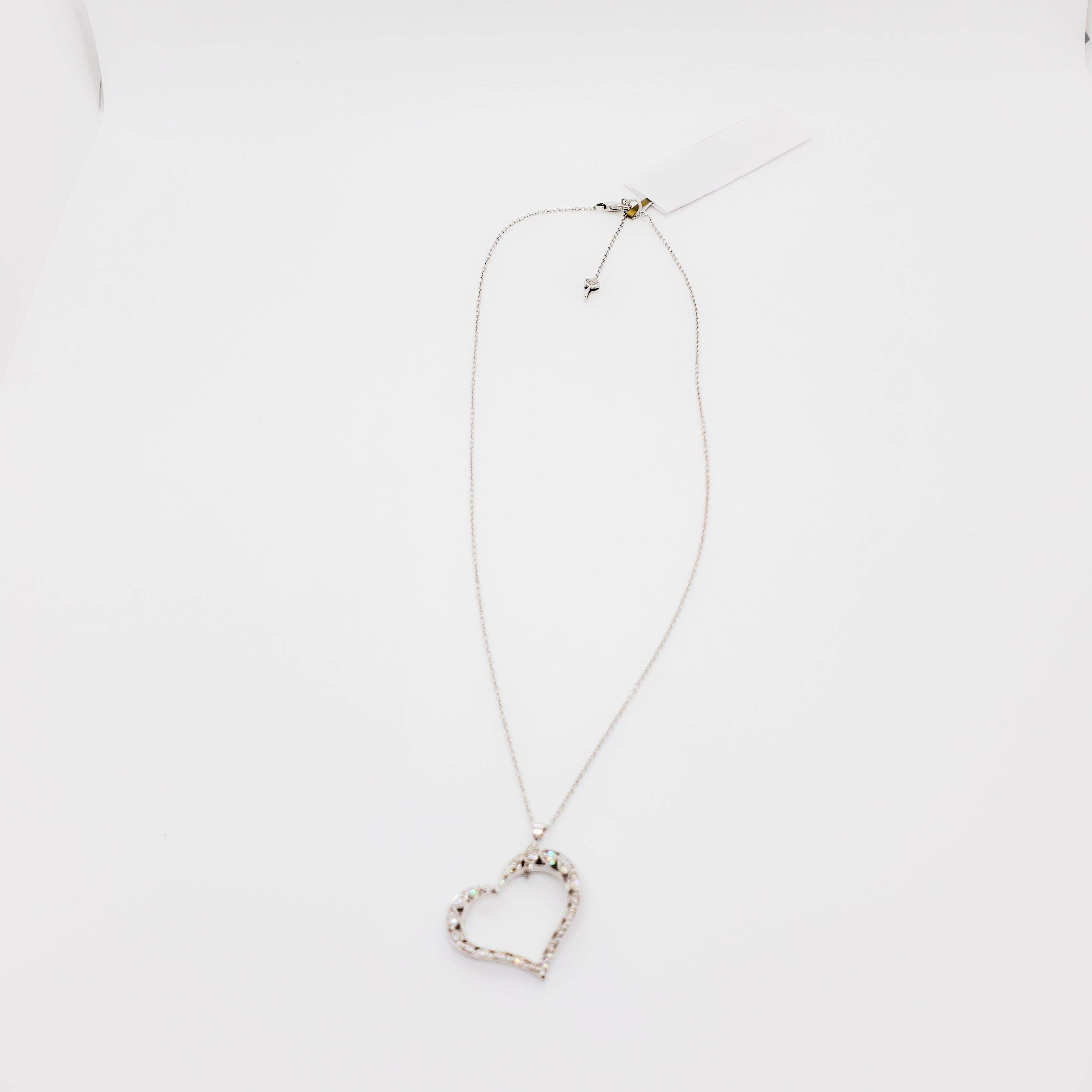 Beautiful and classic Tacori estate heart shape pendant featuring 0.25 ct. of white diamond rounds with a 18k white gold chain and handmade mounting.  Length is 18