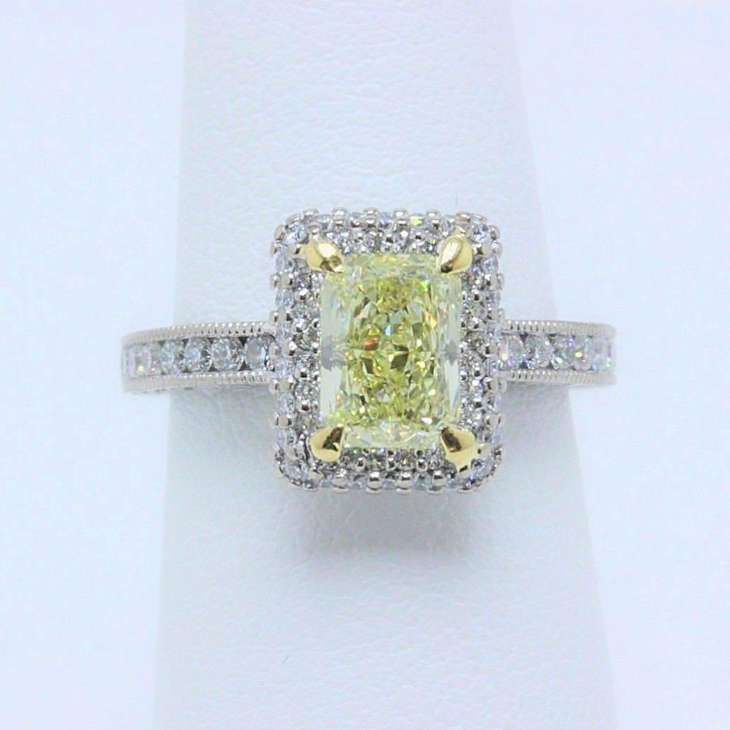 TACORI Fancy Light Yellow Cushion Diamond Engagement Ring 
Style:  Blooming Beauties Collection Halo Diamond Engagement Ring with Diamond Band
GIA Number:  2125014438
Metal:  18KT White & Yellow Gold
Size:  5.25 - Sizable
Total Carat Weight:  1.98