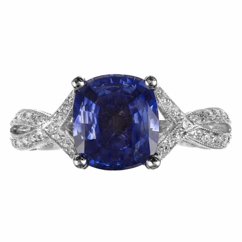 Tacori sapphire and diamond engagement ring. GIA certified rich cushion cut all-natural periwinkle blue 2.07ct sapphire mounted in a platinum split shank setting. Accented with 74 round diamonds around the crown and run along both sides, top and