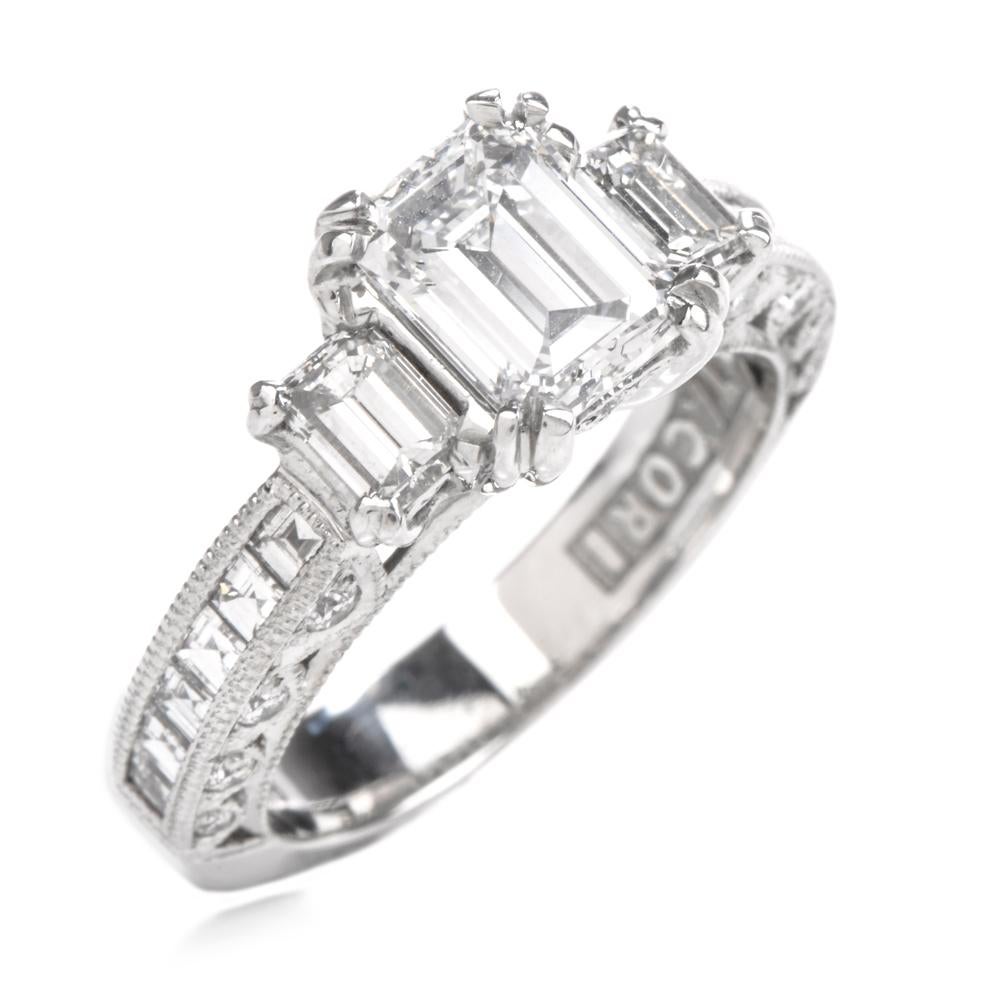 This diamond engagement ring is beautifully crafted in solid platinum, weighing 6.6 grams and measuring 9mm x 8mm high. Centered with one prong-set GIA lab reported,  certified emerald-cut diamond weighing 1.05 carats, graded D color and VS2