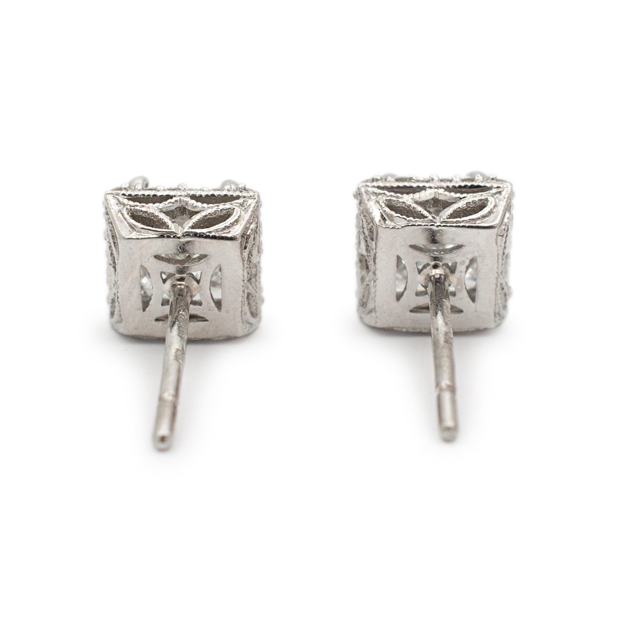 Brand: Tacori

Gender: Ladies

Metal Type: 18K White Gold

Length: 0.50 Inches

Width: 6.50 mm

Weight: 2.10 grams

Ladies filigree-style 18K white gold diamond halo stud earrings with push backs. Engraved with 