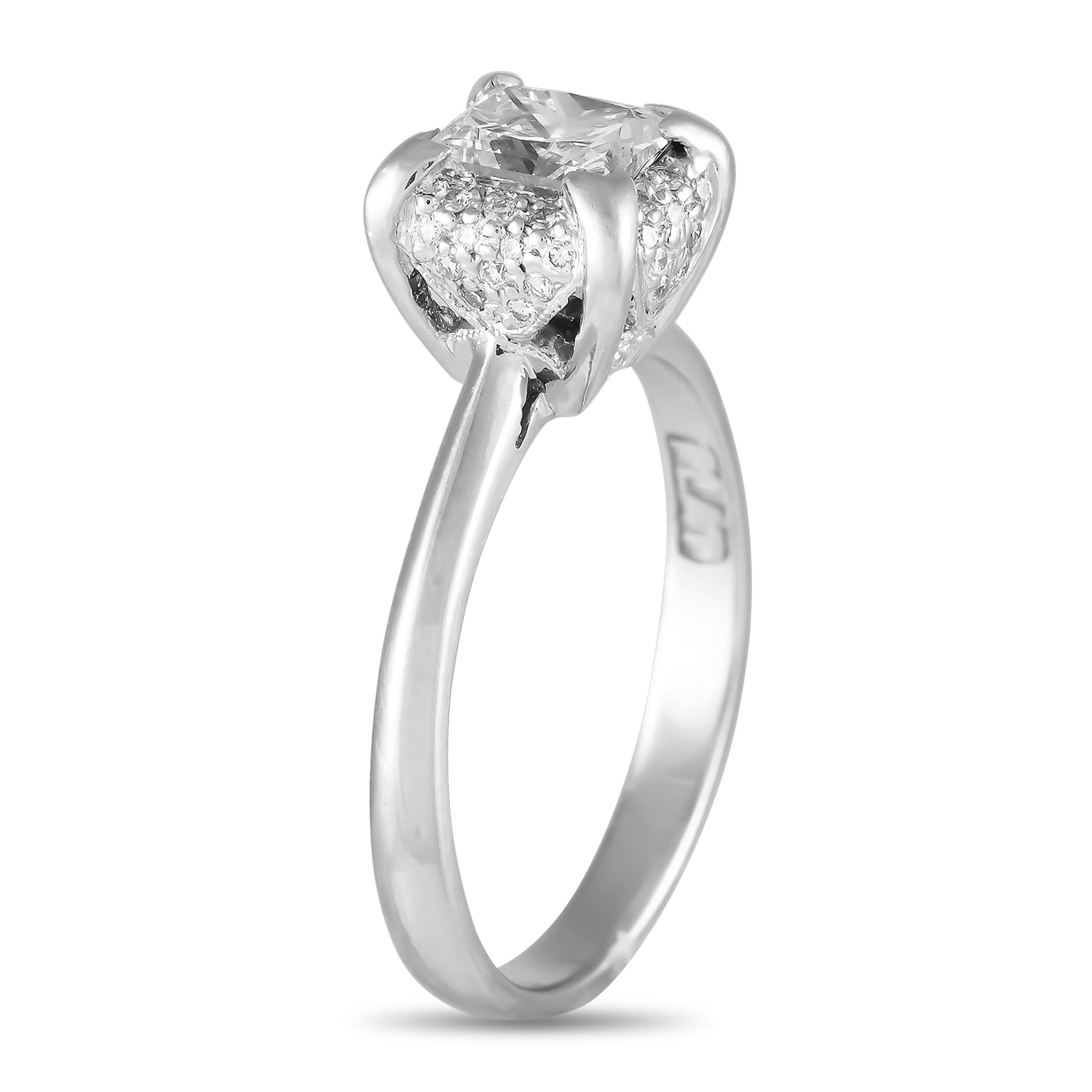 Tacori added an exquisite flair to the classic solitaire with this diamond ring. It features a platinum shank with a four-prong crown that securely cradles a 1.01-carat modified rectangular brilliant diamond with F color and VS2 clarity grade. Just