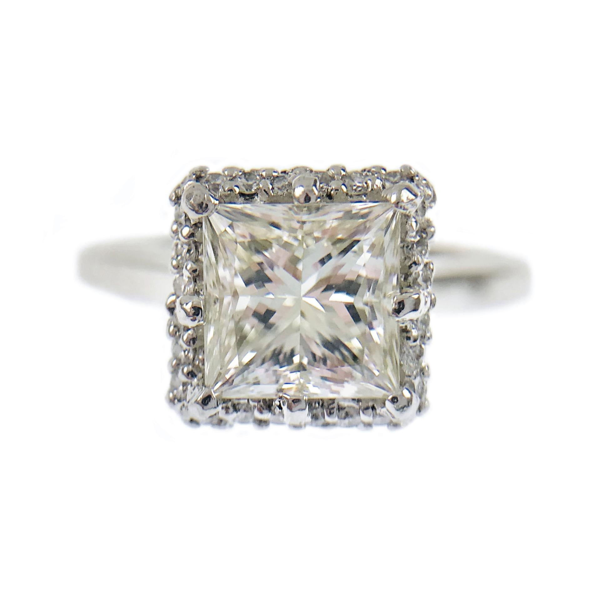 Gorgeous Tacori Platinum Princess-Cut Diamond Halo Engagement Ring. The center Diamond is GIA Certified, 1.59 carat weight. The diamond is VS1 (G.I.A.) in clarity and M (G.I.A.) in color. The ring size is 6 1/2. The total carat weight of the halo of