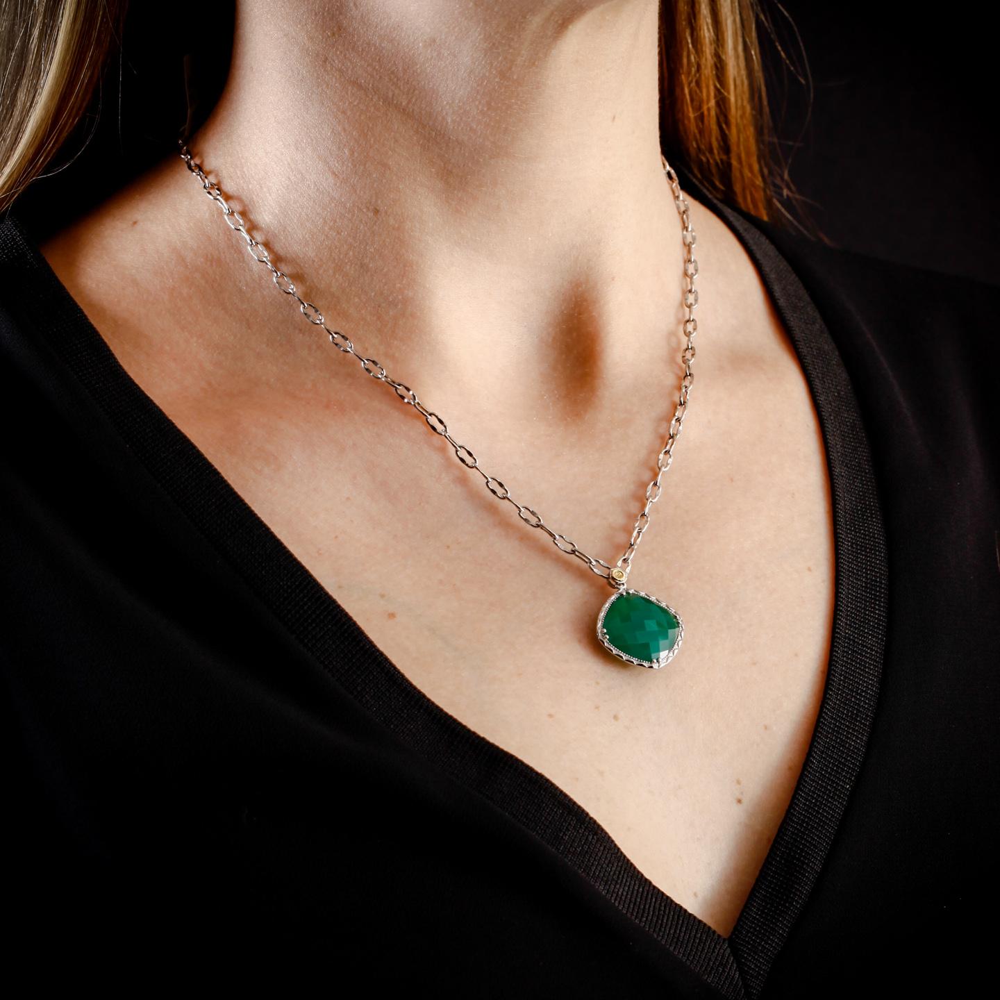 This Tacori Silver necklace is set with a 20x20mm cushion-shaped green onyx stone. The Tacori stamp featured on the bale is 18k yellow gold. The silver Tacori chain is 18 inches long. This necklace is in perfect condition and has never been worn.