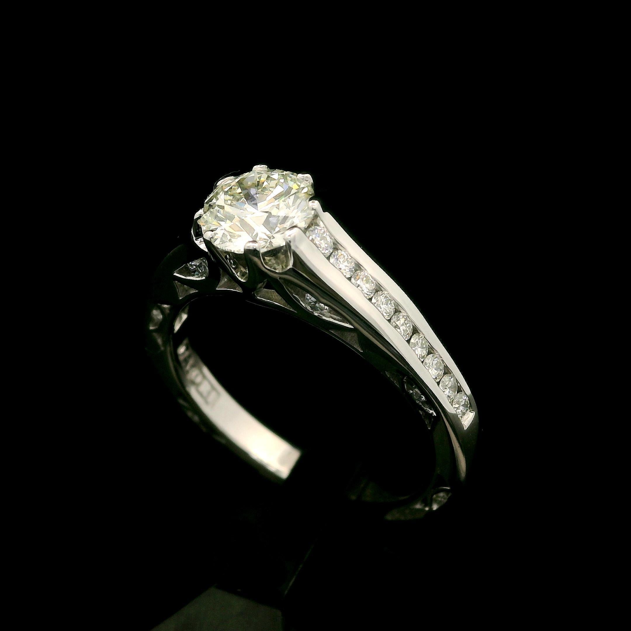 --Stone(s):--
(1) Natural Genuine Diamond - Round Brilliant Cut - Prong Set - Triple Excellent - J Color - VS1 Clarity - 1.16ct (exact - certified)
** See Certification Details Below for Complete Info **
(30) Natural Genuine Diamonds - Round