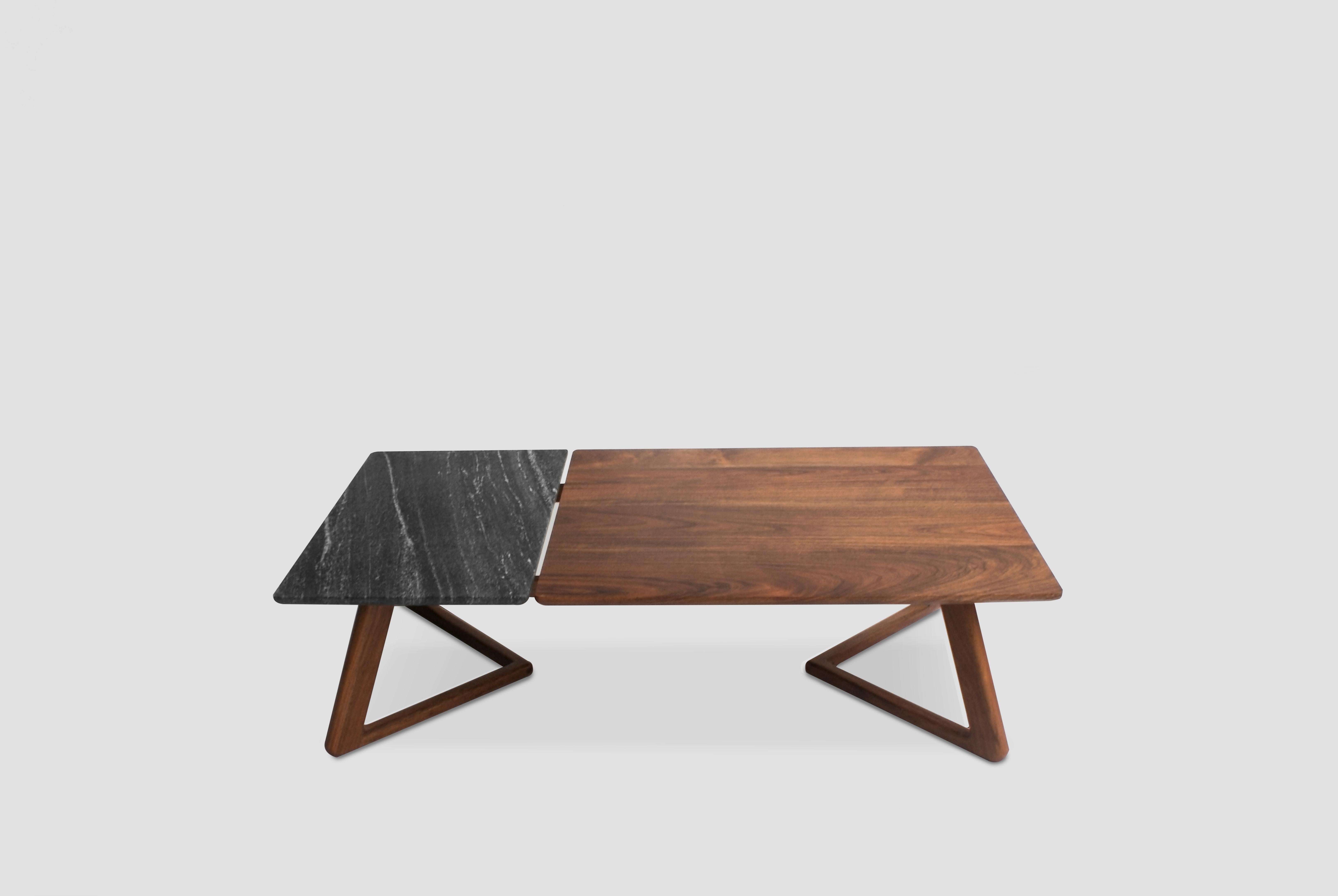 Tacua coffee table by Óscar Núñez
Dimensions: D 200 x W 110 x H 35 cm
Materials: walnut wood, ebony crystal granite.
Available in other sizes.

Ebony crystal granite and walnut coffee table.

Oscar Nuñez is an industrial designer graduated