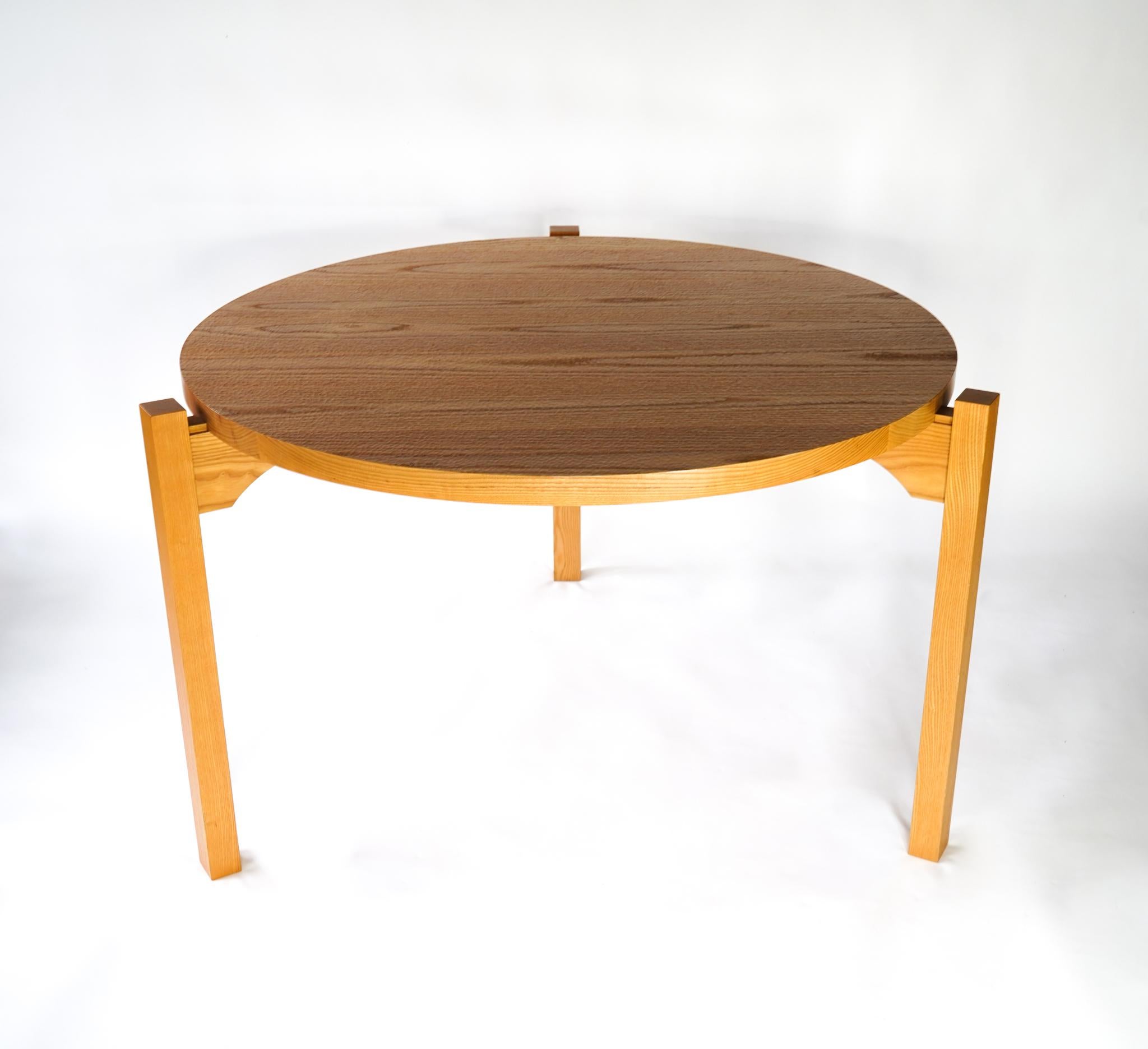 Tadao Arimoto three leg dining table with carved top. Japanese-American master woodworker, Tadao Arimoto's unique dining table featuring three legs that insert into the table top via a grooved joint for ease of assembly/disassembly, moving and