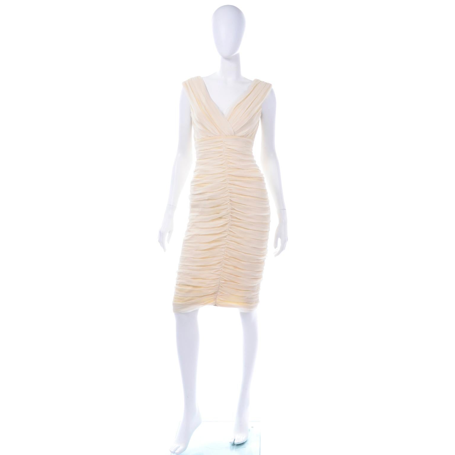 This cream silk ruched sleeveless dress from Tadashi is so lovely! The silhouette makes this a very interesting and flattering evening dress. The cream color can really be worn year round when paired with the right accessories and shoes! We love