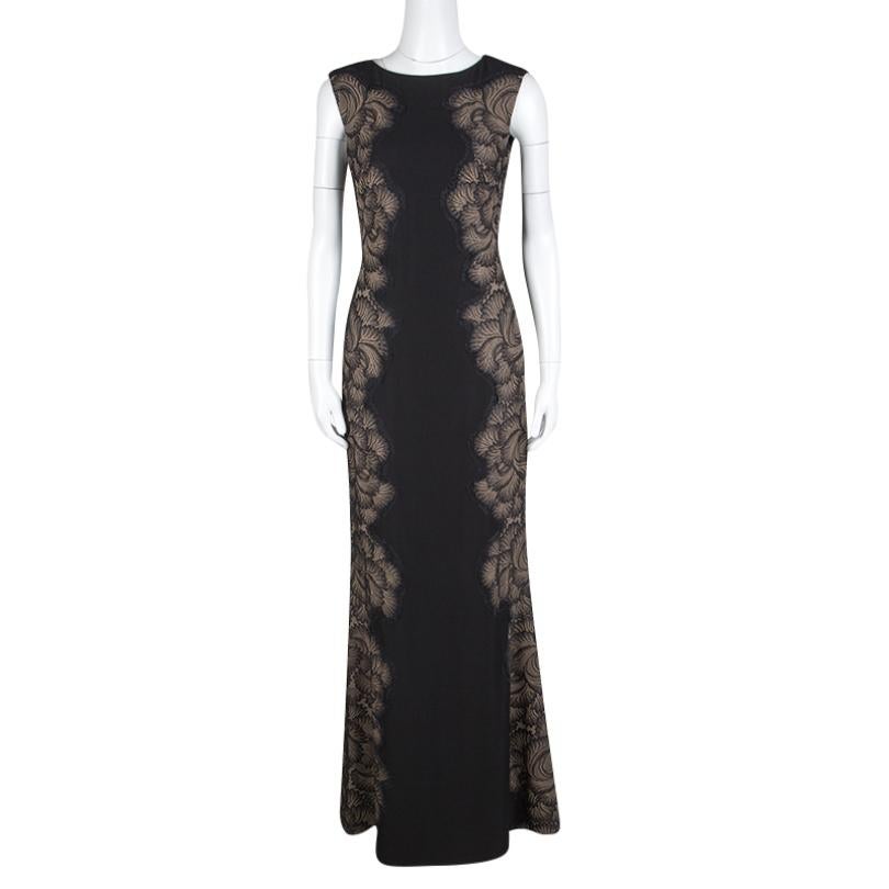 Sweep the dance floor in style by gracing this sexy evening gown artistically crafted by Tadashi Shoji. It is finely stitched with a boat-shaped neckline and sleeveless pattern showing off your delicate accessory well. The sides are paneled with