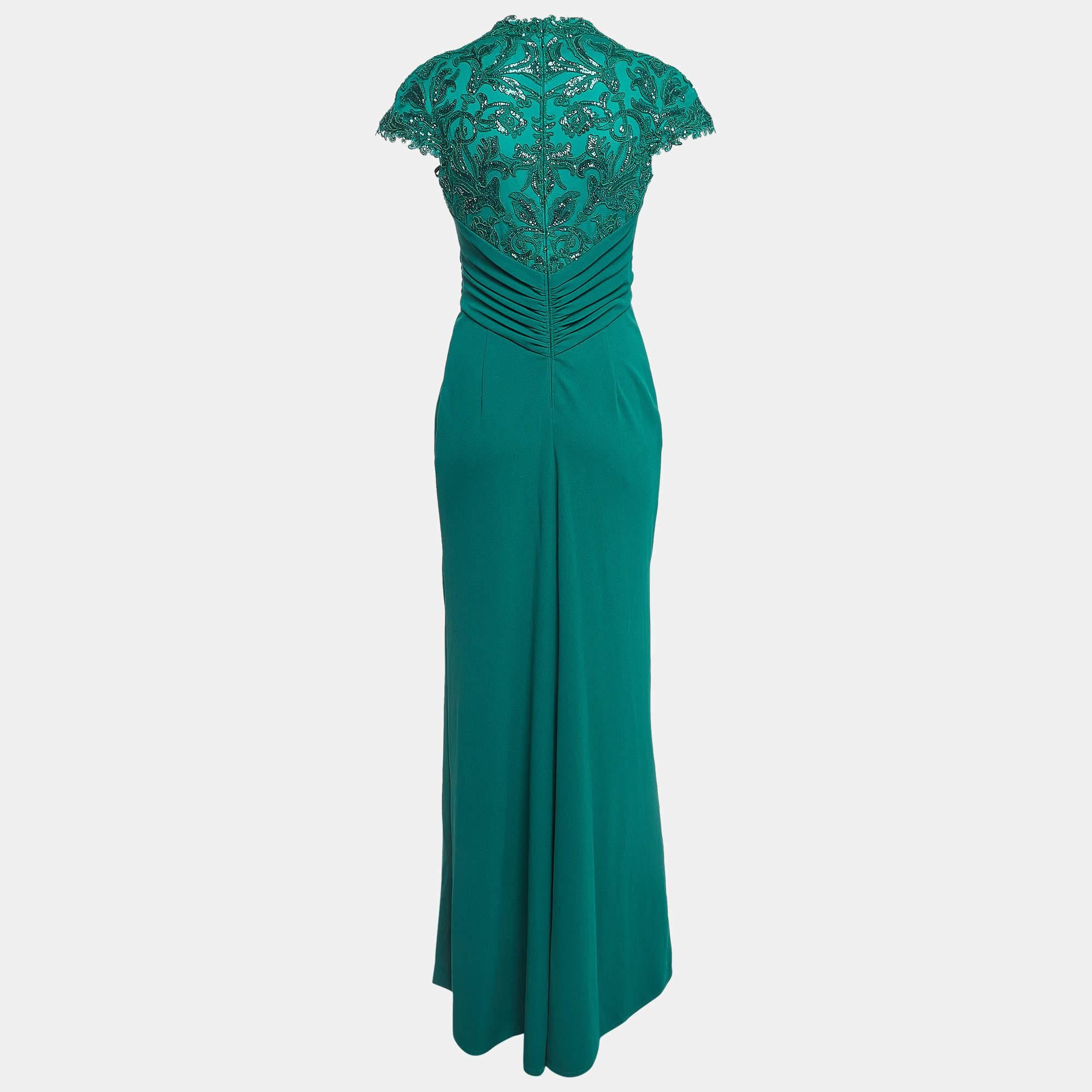 To glide the evenings away like a dream Tadashi Shoji ensures this emerald green gown is given a maxi length and a comfortable fit. Tailored beautifully the gown has a sequin embellished bodice and drape detailing on the waist.