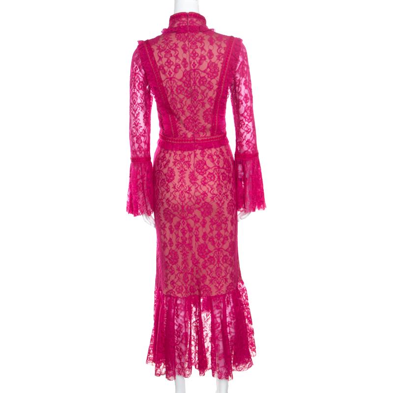Tadashi Shoji brings you this beautiful dress that was launched as part of their Pre-Fall 2017 collection. The dress has a luscious fuchsia lace overlay with ruffles, a back zipper and an asymmetric hem. pastel sandals or metallic gold ones will