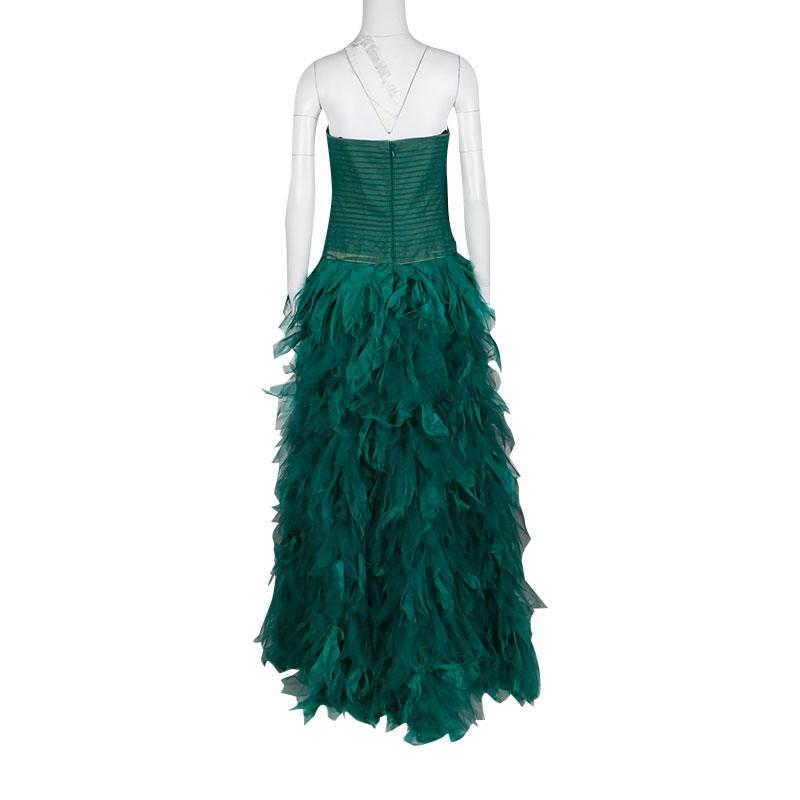 Masterfully constructed in nylon, this dress will make a perfect piece for celebratory events. This green dress, featuring a fitted bodice and flowy feathered skirt, also comes with a zip to create a favorable shape. From Fall Winter 2015
