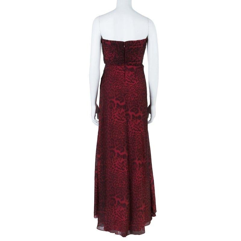 This Tadashi Shoji gown takes the brand's signature image to new heights. Made from red silk, it features an exotic leopard print. The structured bodice forms a strapless sweetheart neckline and has a gathered detail at the front, giving a feminine