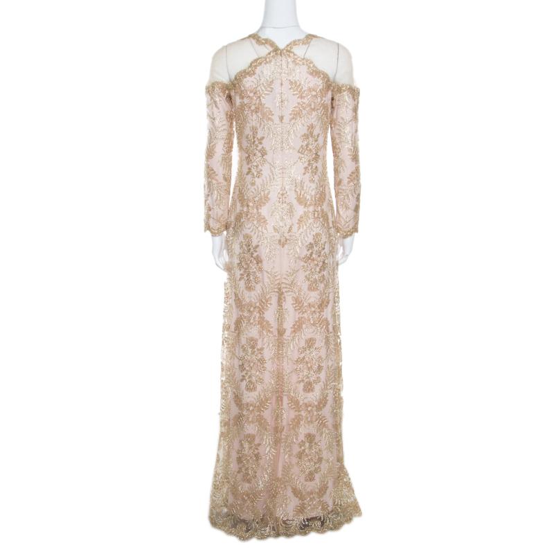Look your stunning best in this dress from the house of Tadashi Shoji. Style this gold piece with cute accessories for ladylike elegance. This elegant dress in a blended fabric is sure to grab everyone's attention. It comes with long sleeves and a