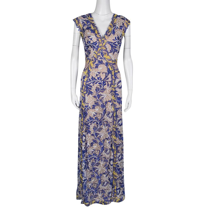 This Amalie gown from Tadashi Shoji features floral embroidery in a mix of colors making the dress a breezy creation. The intricately crafted soft details adorning the dress exude feminity and elegance. The sleeveless gown can be styled with a loose