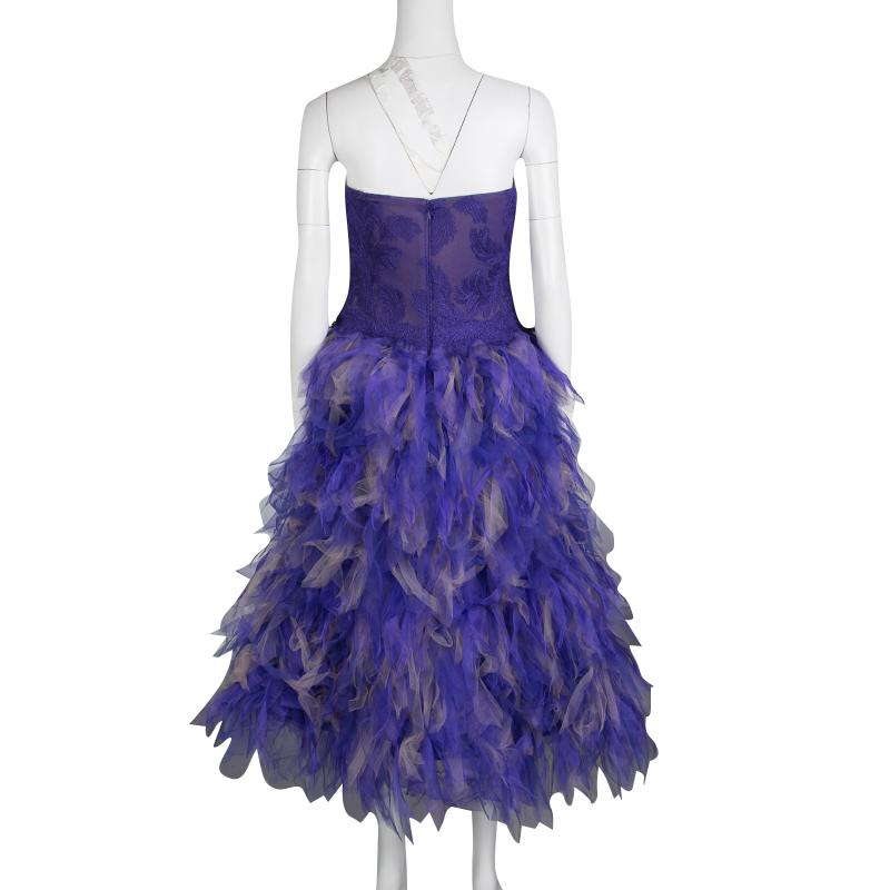 Tadashi Shoji's Fall-Winter collection of 2015 was all about floating, aerial dresses with a sense of flight. A part of the collection, this purple strapless dress comes with an embroidered bodice and beautifully feathered, tulle bottom. This