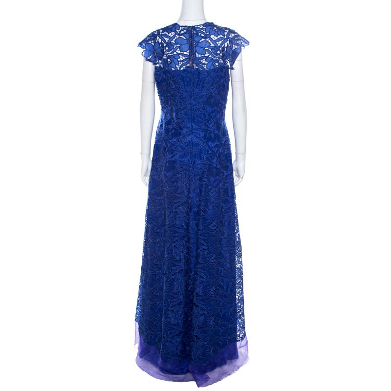 This Tadashi Shoji dress takes the brand's signature image to new heights. Adorned in blue, it features feminine lace design all over. It has a lovely silhouette complemented with a floor-grazing length and cap sleeves.

Includes: The Luxury Closet