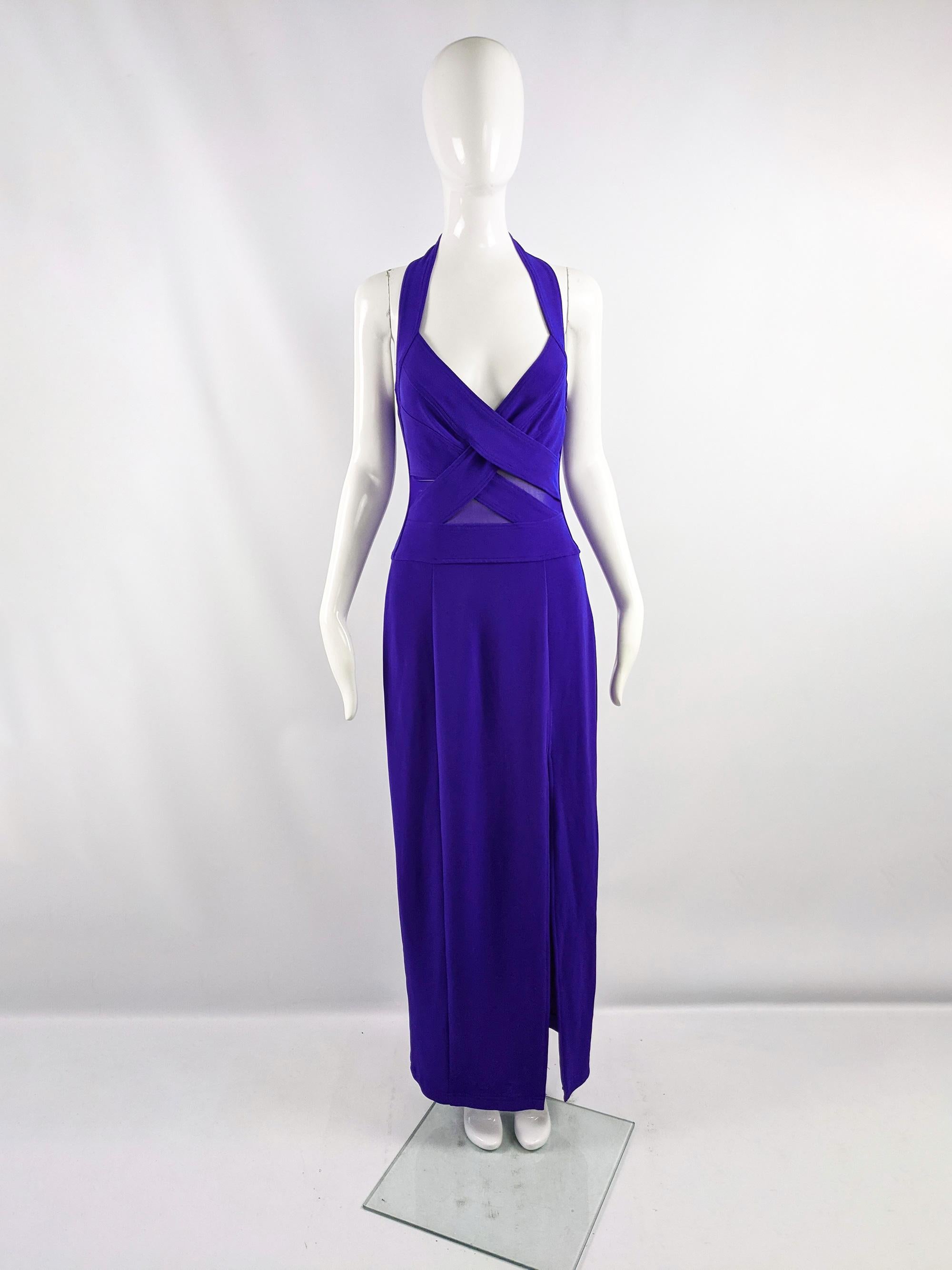 A sexy vintage womens maxi evening dress from the 90s by luxury American- Japanese fashion designer, Tadashi Shoji. In a thick purple stretch jersey with a halter neck and sheer mesh cut outs at the waist. Perfect for a party. 

Size: Unlabelled;