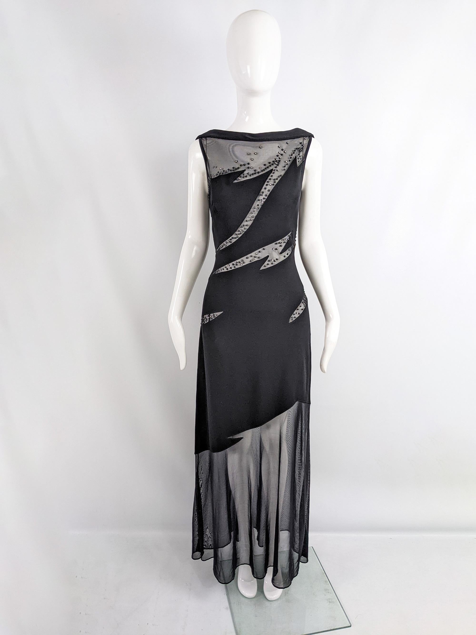 An incredibly sexy vintage evening gown from the 90s by luxury fashion designer, Tadashi Shoji. In a black rayon stretch jersey withcompltely sheer, mesh cut outs embellished with beading.

Size: Marked vintage M but measures roughly like a modern