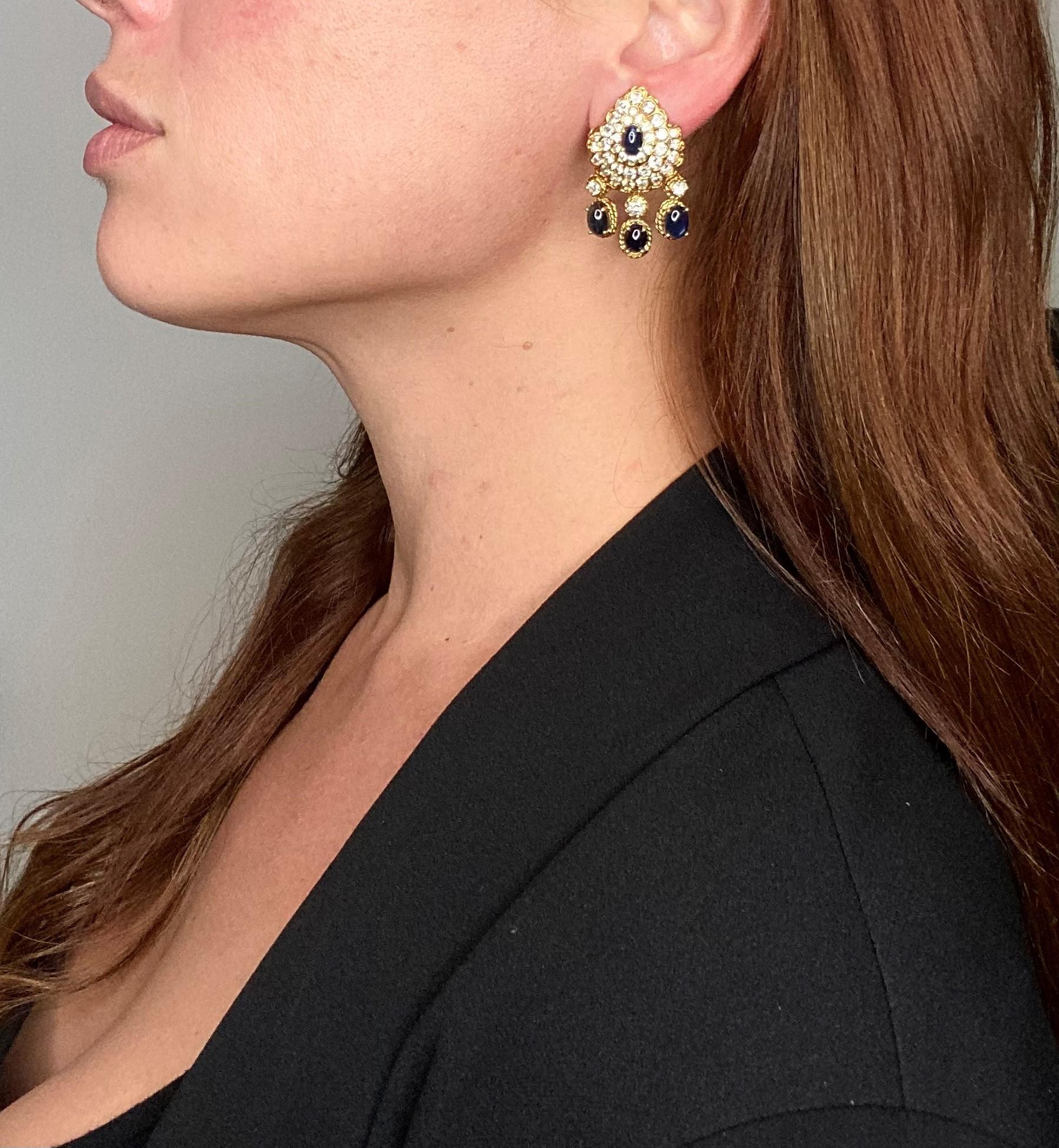 Statement cluster earrings designed by Tadini.

Exceptional pieces with great look, created by the jewelry house of Tanini, back in the 1970's. These pair of dangle cluster earrings has been carefully crafted in solid yellow gold of 18 karats and