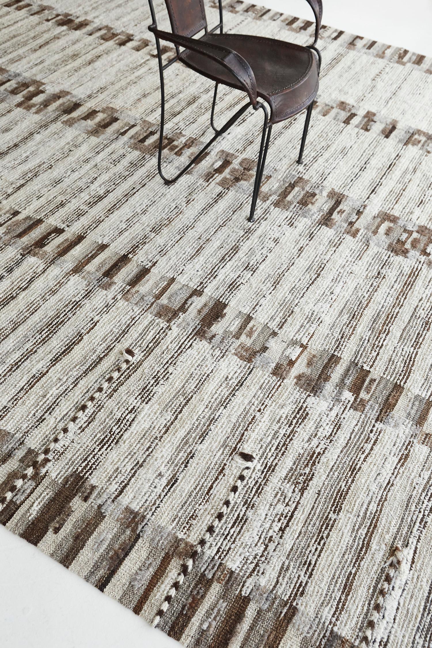 Tafsut is a pile of woven wool that displays art and creativity. It features a natural contrast color scheme of natural brown. Visible abrash magnifies the rug's character and leaves an impression that surely a viewer cannot resist. A piece that is