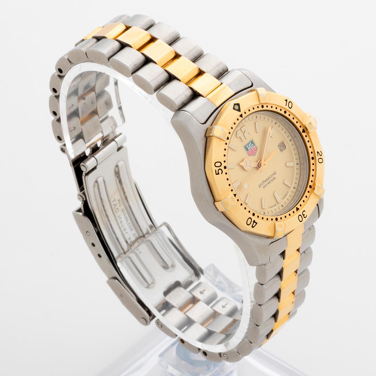 Our instantly recognisable ladies Tag Heuer 2000 Professional quartz with date (reference WK1321) features a 28mm stainless steel and gold tone case and stainless steel and gold tone bracelet with folding fliplock clasp (with divers extension).