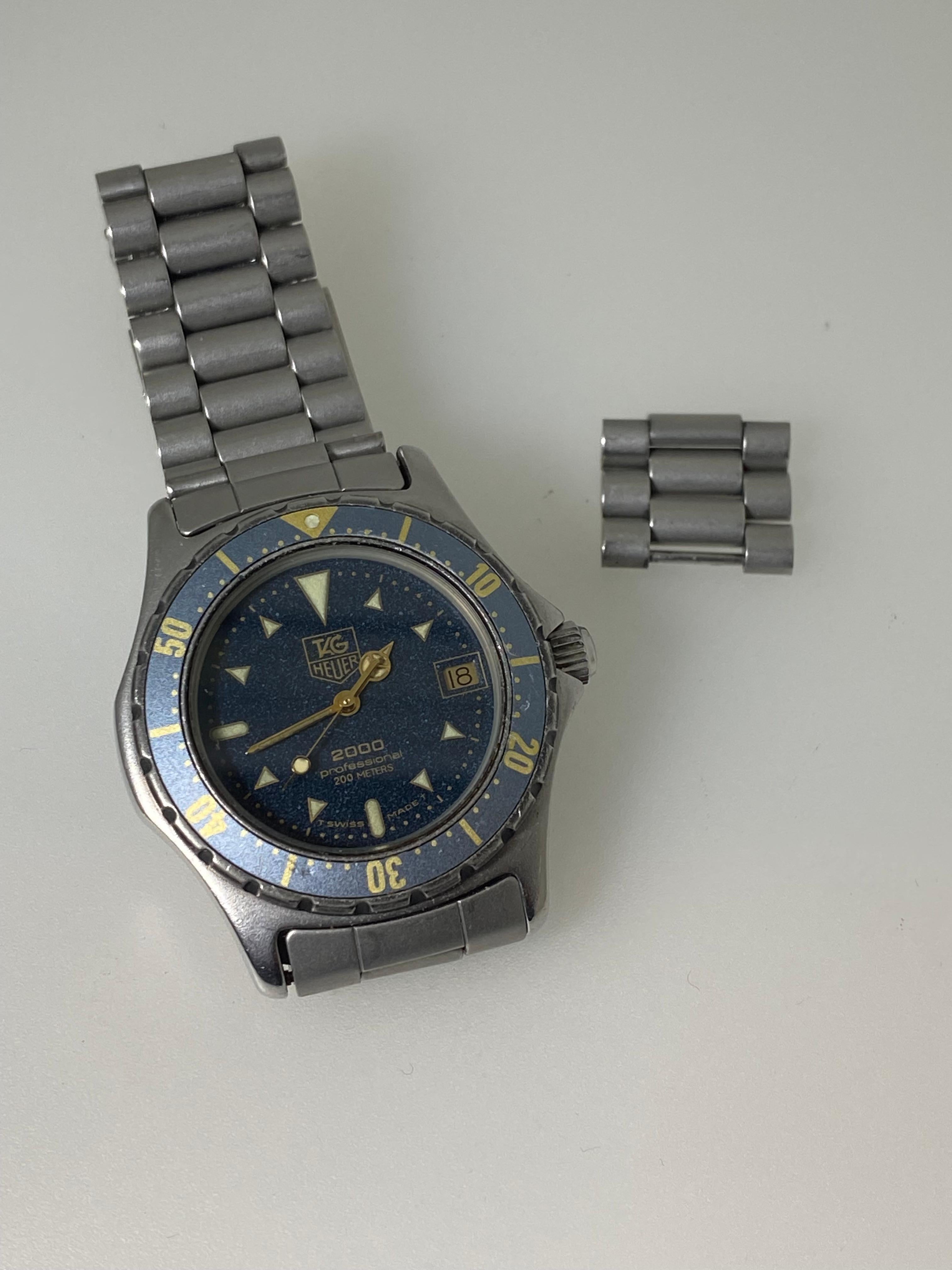 TAG Heuer 2000 Professional 200 Meters 
ref 972 613 Gents' Wristwatch features: 

35mm Stainless Steel Case,
in matte finish  
with screw down back & crown & 
rare Aluminium blue coloured Rotating Bezel 
with golden highlights 
The case is signed &