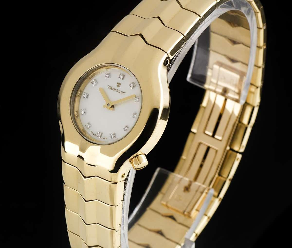 An 18k Yellow Gold Alter Ego Ladies Wristwatch, mother of pearl (MOP) dial set with 12 round brilliant cut diamond hour markers, a fixed 18k yellow gold bezel, an 18k yellow gold bracelet with an 18k yellow gold concealed double deployant clasp,