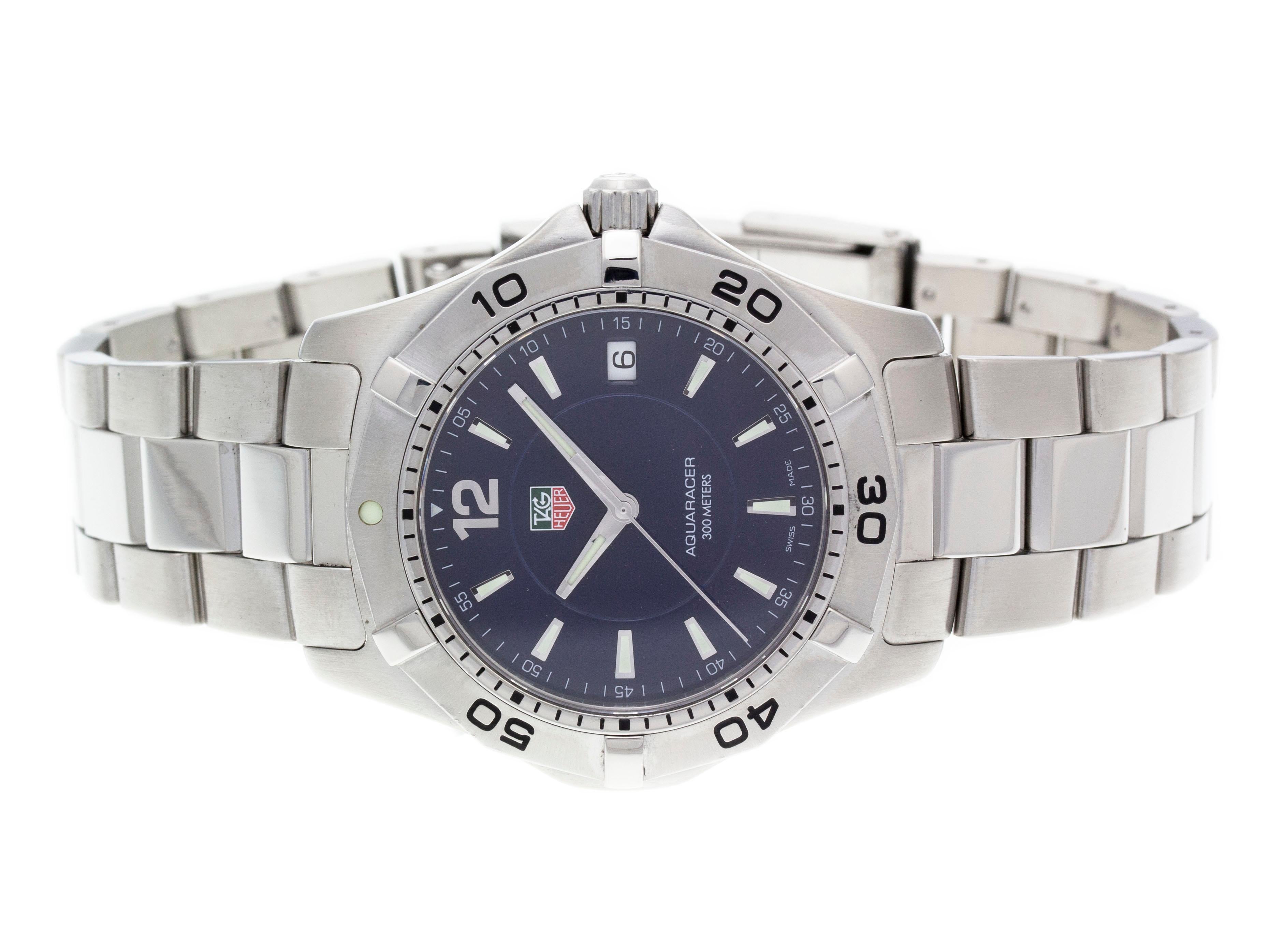 Stainless steel Tag Heuer Aquaracer 2000 quartz watch with a 38.4mm case, navy blue dial, and bracelet with folding clasp. Features include hours, minutes, seconds and date. Comes with a Gift Box and 2 Year Store Warranty.​

Brand	Tag