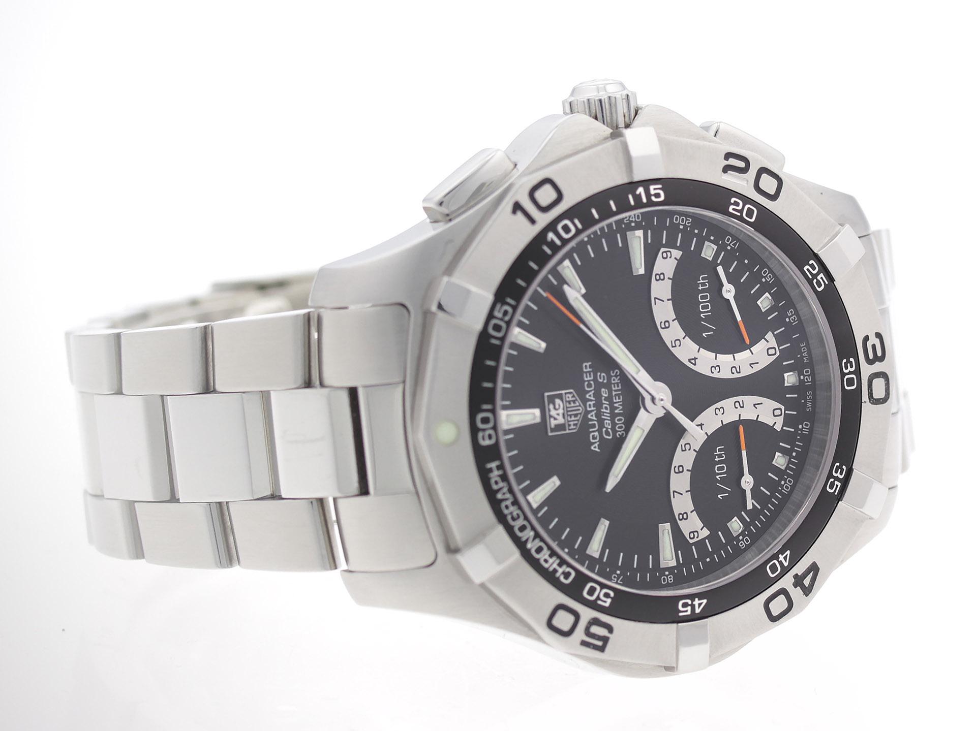 Stainless steel Tag Heuer Aquaracer CAF7010.BA0815 watch, chronograph, with tachymeter, regatta timer, and perpetual calendar.

Watch	
Brand:	TAG Heuer
Series:	Aquaracer
Model #:	CAF7010.BA0815
Gender:	Men’s
Condition:	Great Condition Pre-owned,